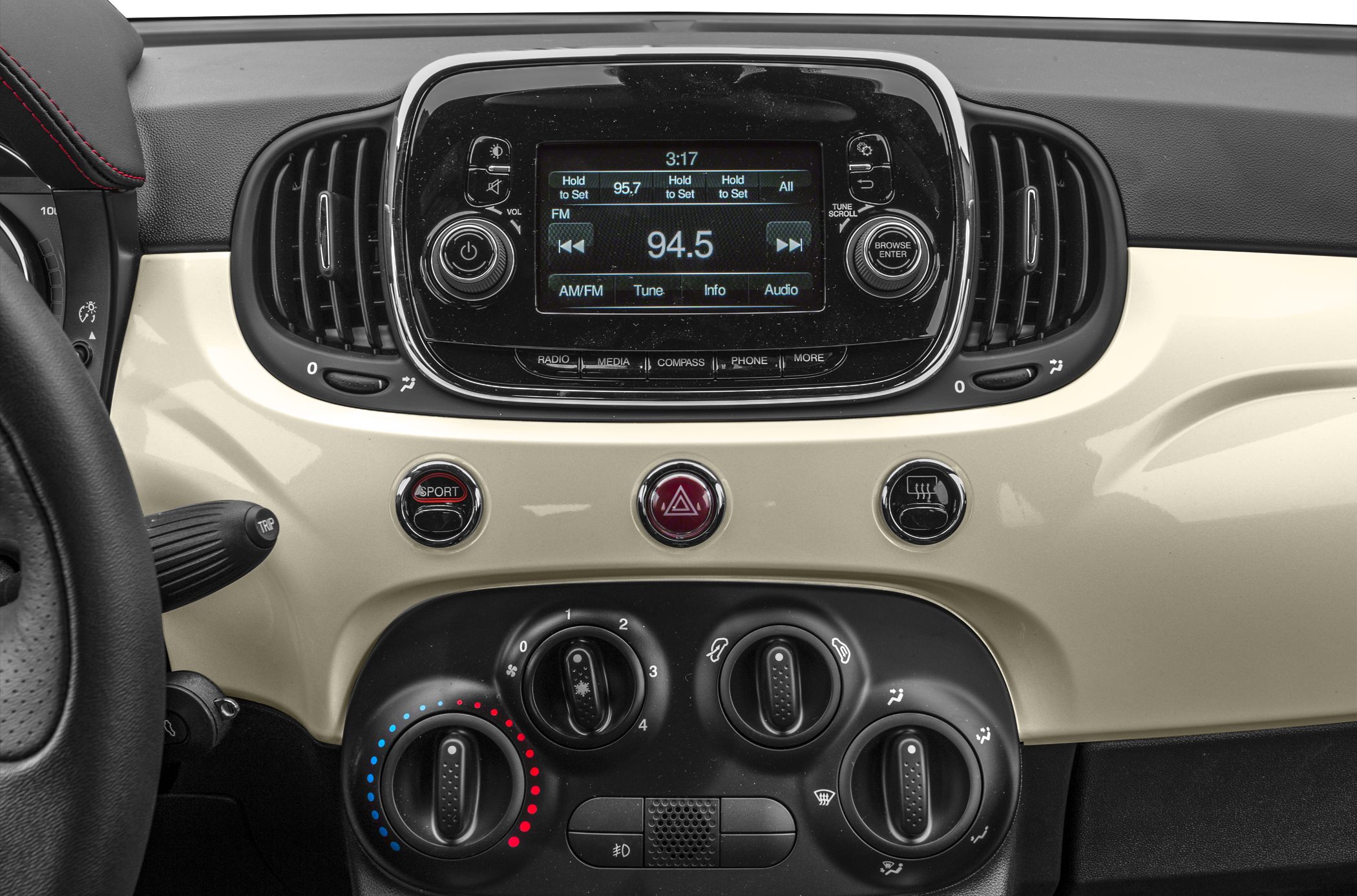 Car dashboard with multimedia screen and climate control knobs