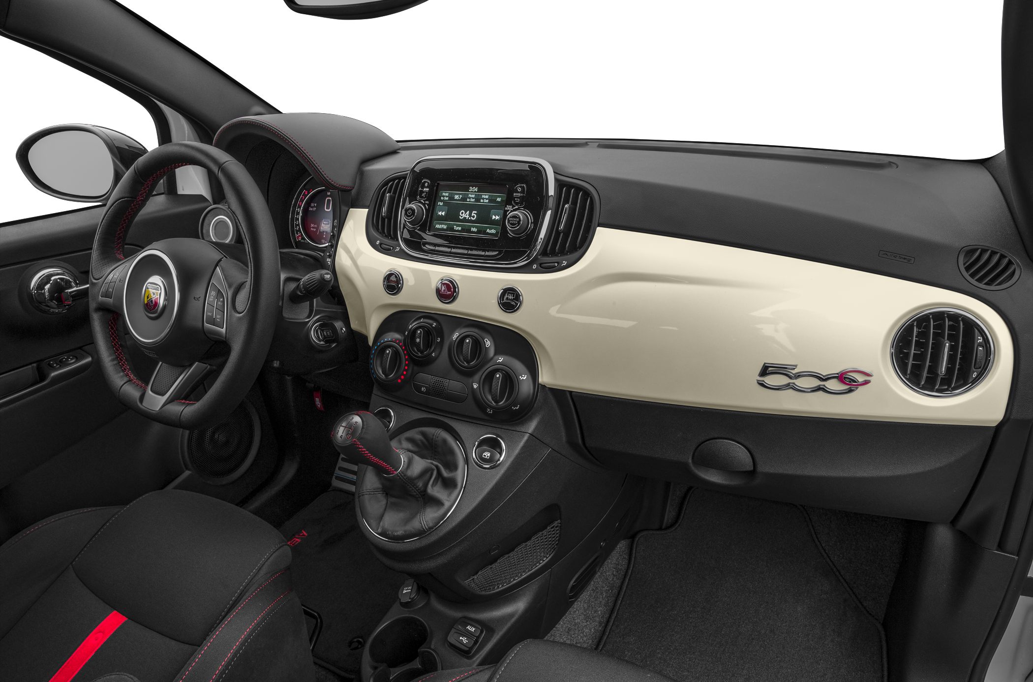 Compact dashboard with round vents, manual gearshift, and central infotainment screen