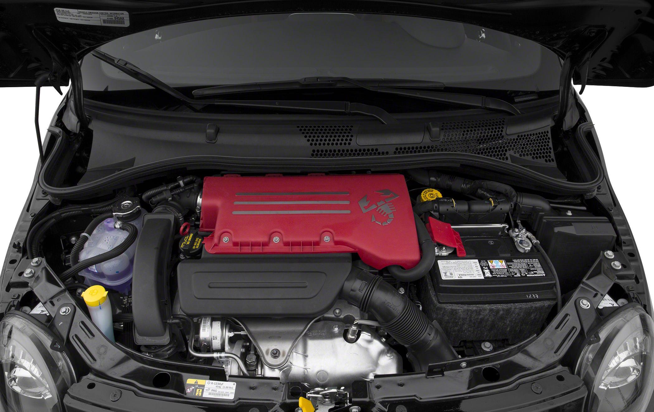 Engine bay with red Abarth cover and battery compartment