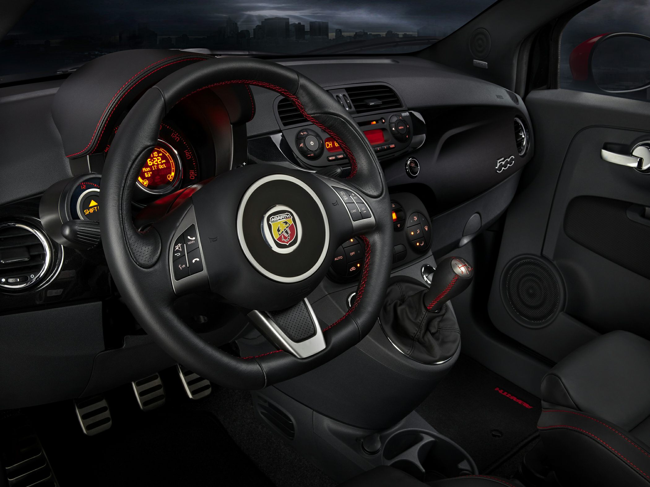 Sporty black interior with Abarth steering wheel and manual gearshift