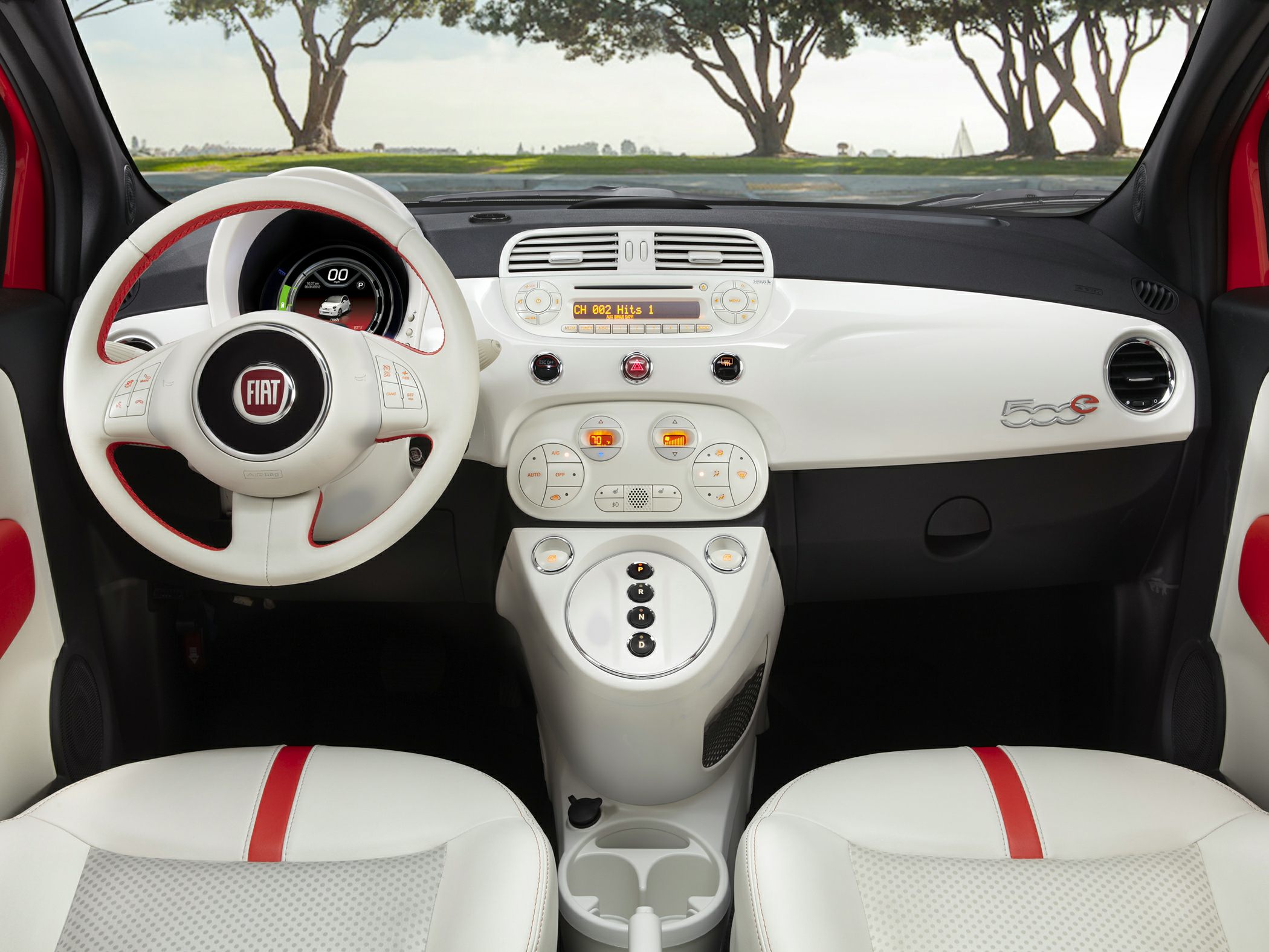 White and red steering wheel and dashboard interior with unique control layout.