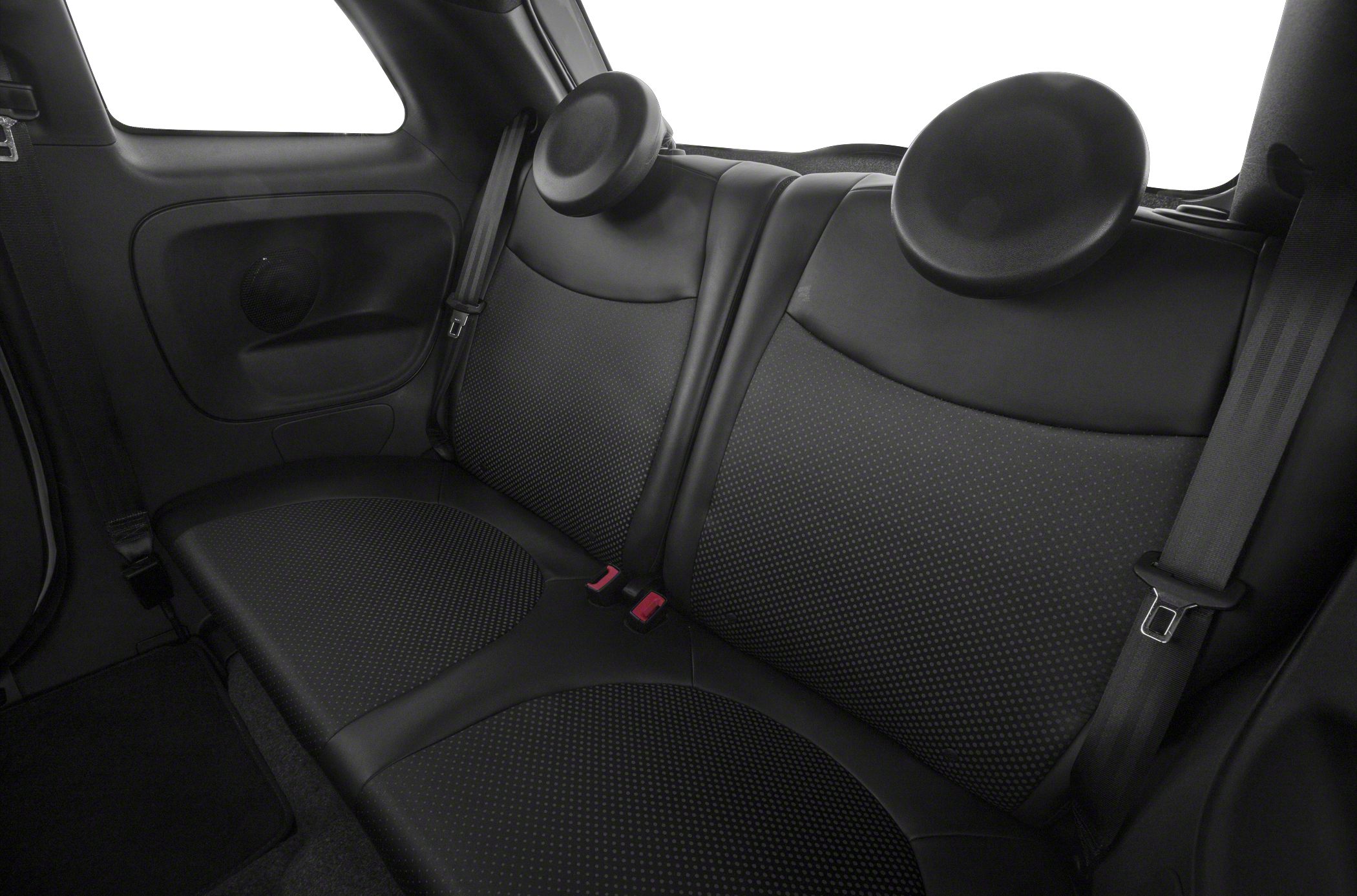 Rear seat interior with black upholstery and integrated speakers