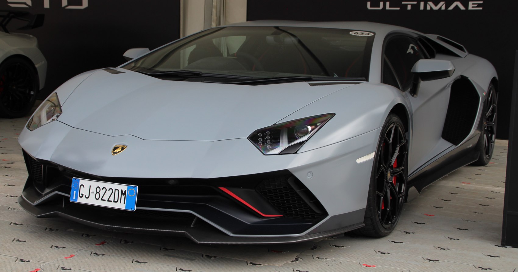 Sharp angular headlights with aerodynamic front splitter