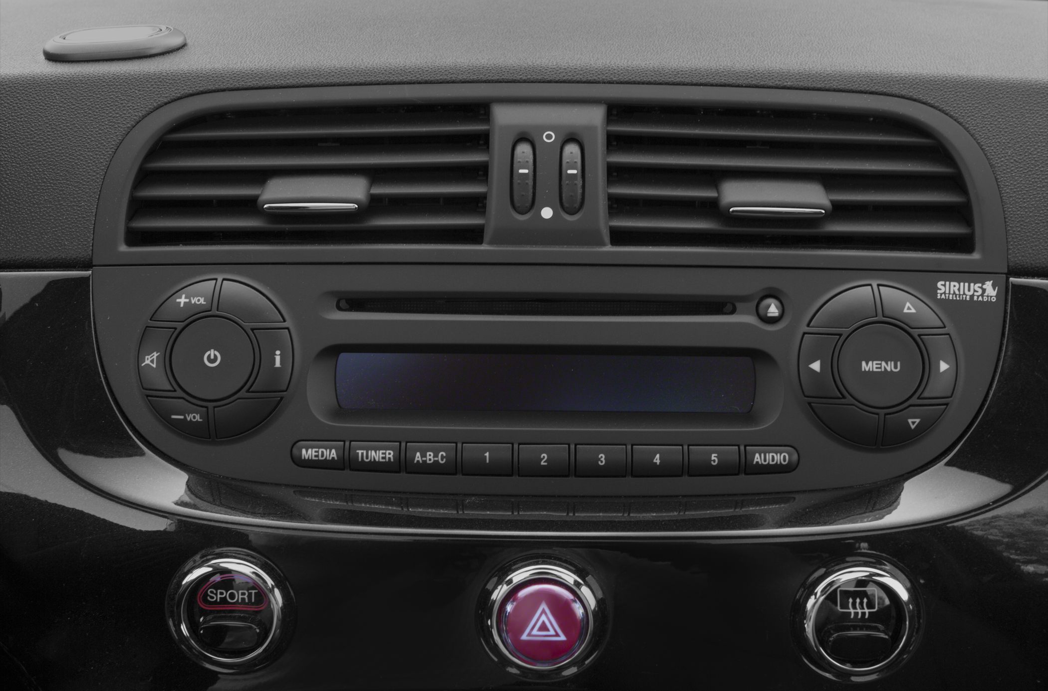 Dashboard radio control panel with media buttons and air vents.