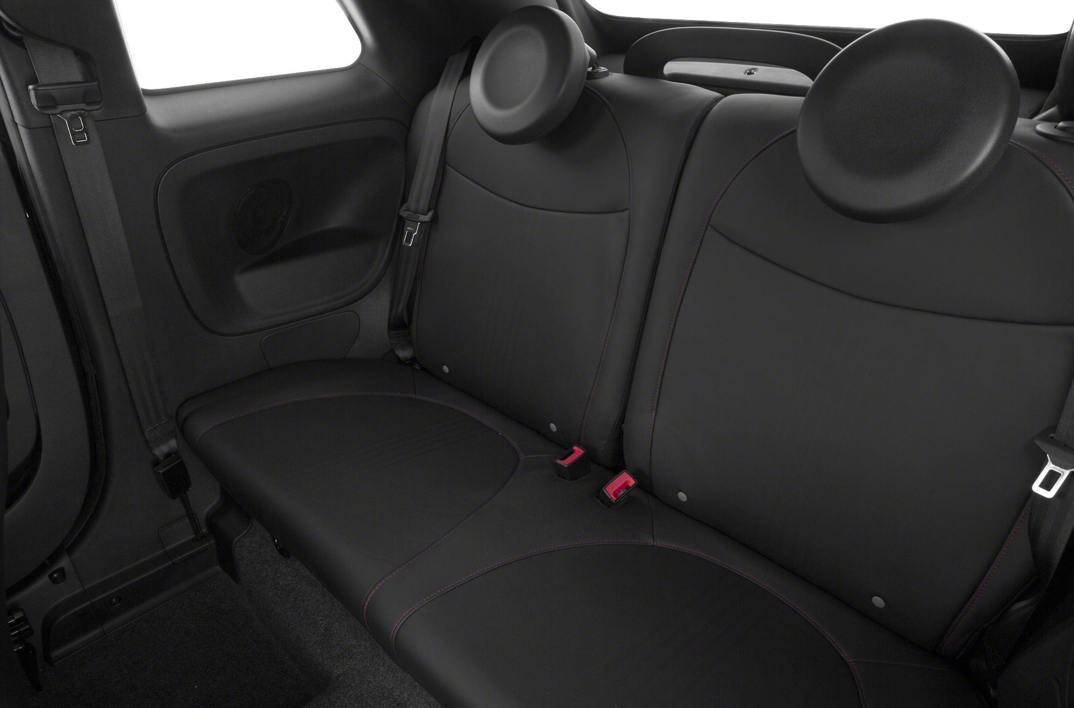 Rear black seats with integrated headrests, seat belts, and door panel speaker