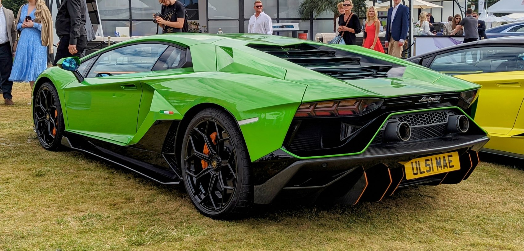 Sharp rear and side design with dual exhaust and black wheels