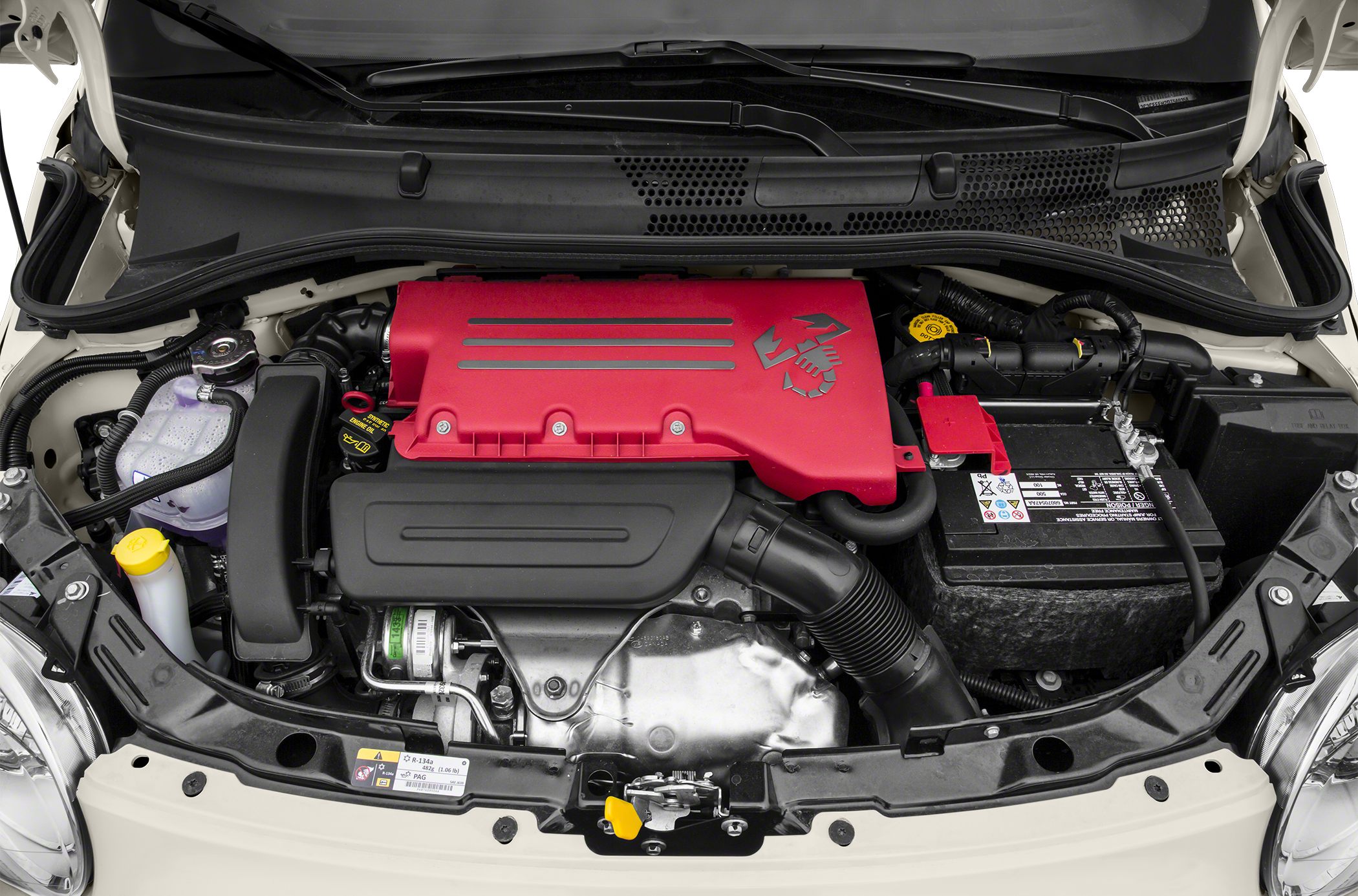 Red engine cover with scorpion logo and adjacent battery setup in compact engine bay