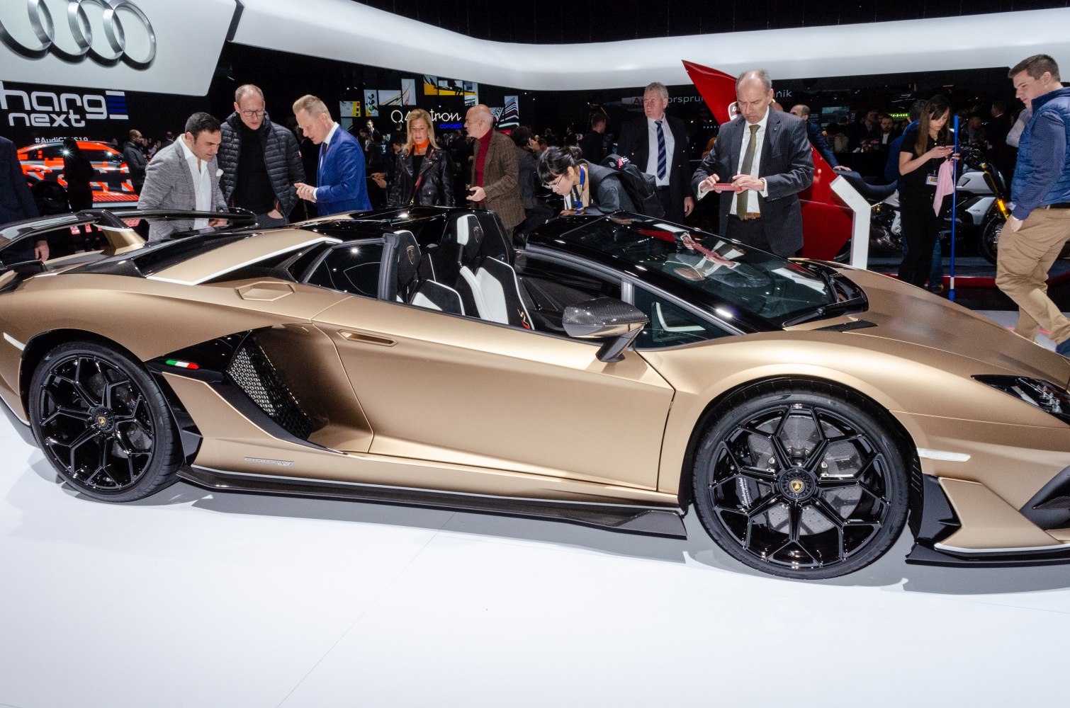 Convertible sports car with black alloy wheels and aerodynamic side vents