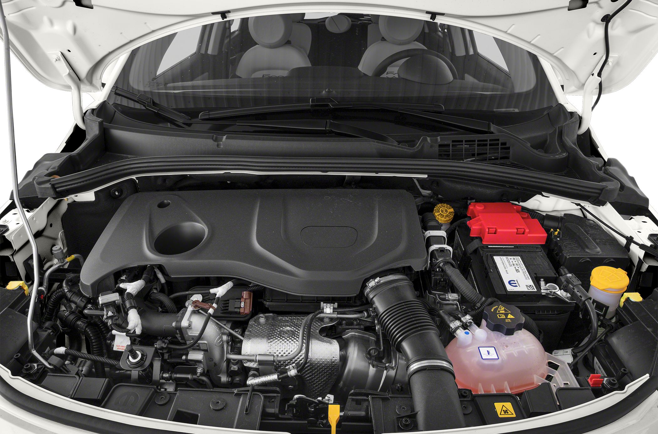 Engine bay view with engine cover, air intake hose, and battery.