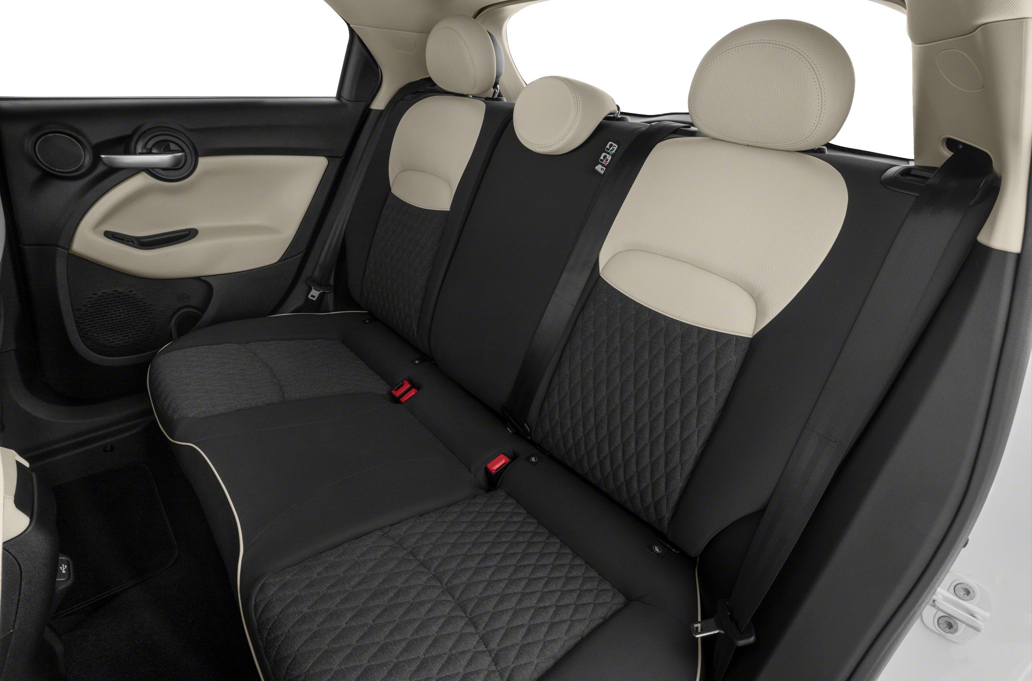 Two-tone quilted rear seats with integrated headrests and seatbelts.