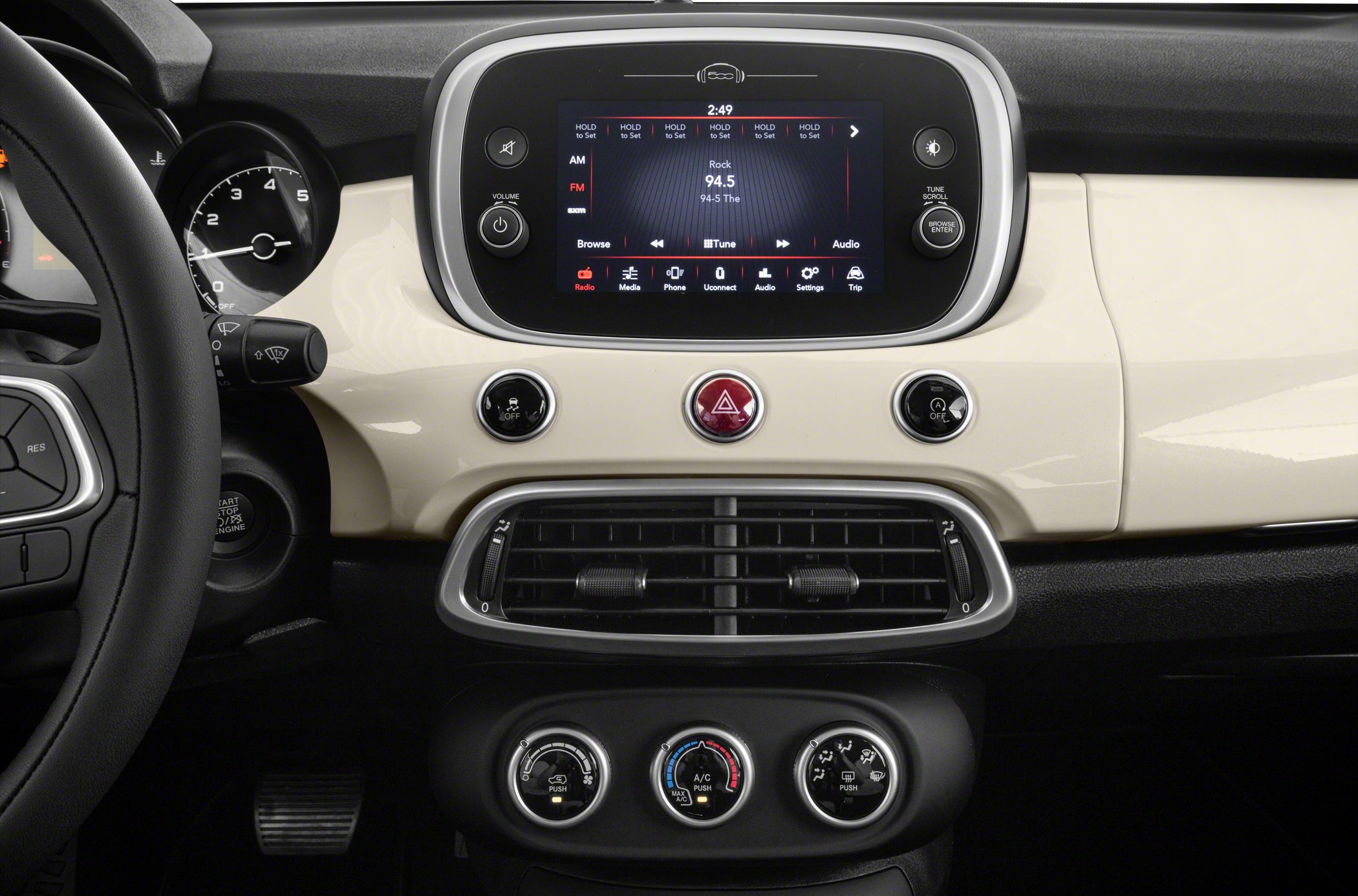 Touchscreen infotainment and climate control dials on car dashboard