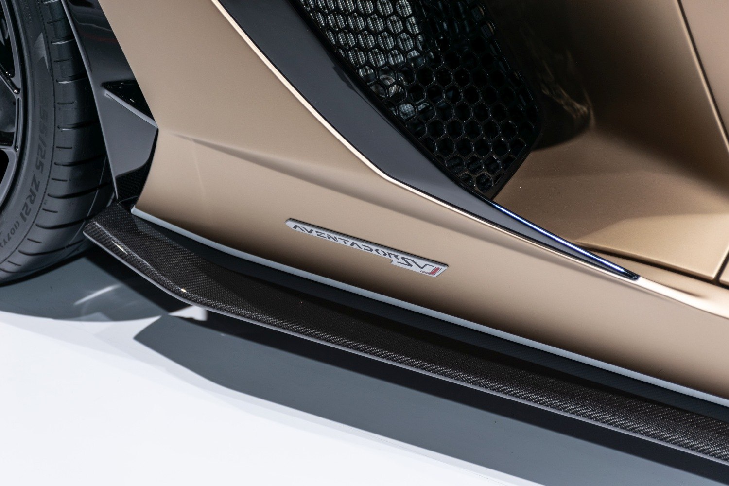 Carbon fiber side skirt and air intake design near rear wheel