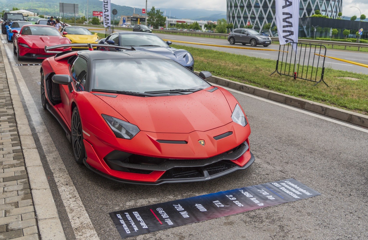 Red sports car with sharp headlights and aerodynamic front design