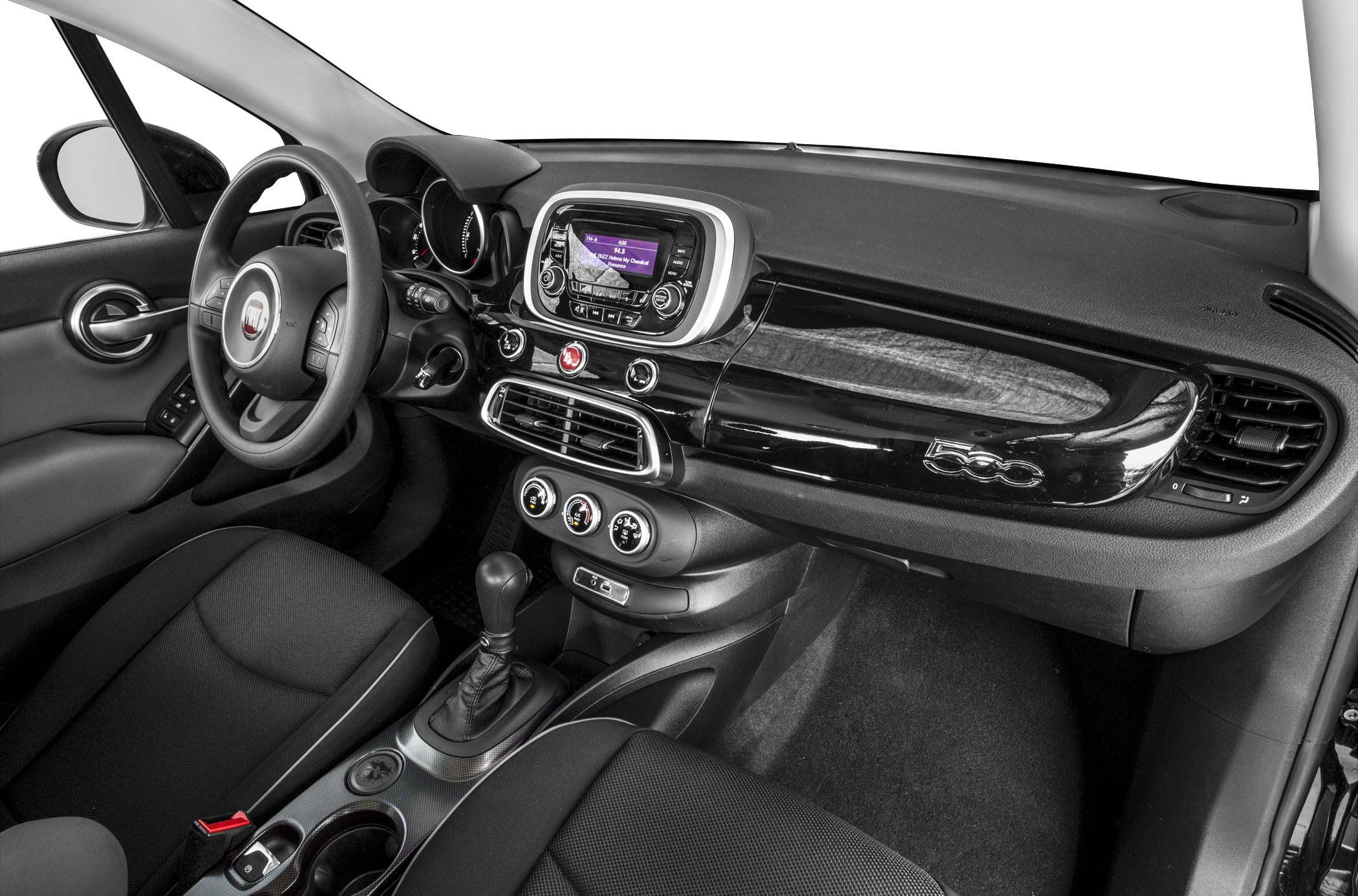 Dashboard, steering wheel, infotainment system, and climate controls.