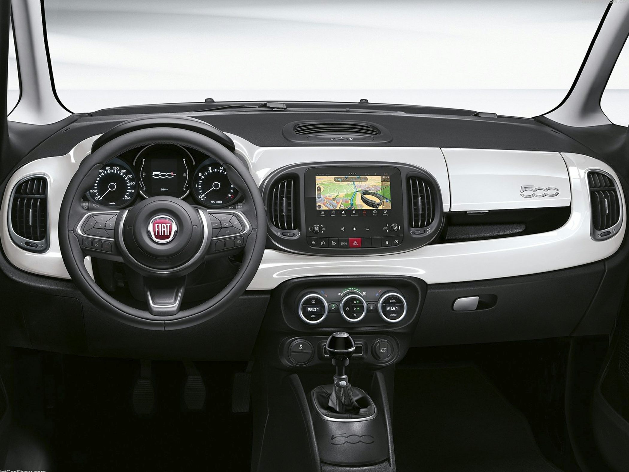 Modern car dashboard with touchscreen navigation and manual gear shift