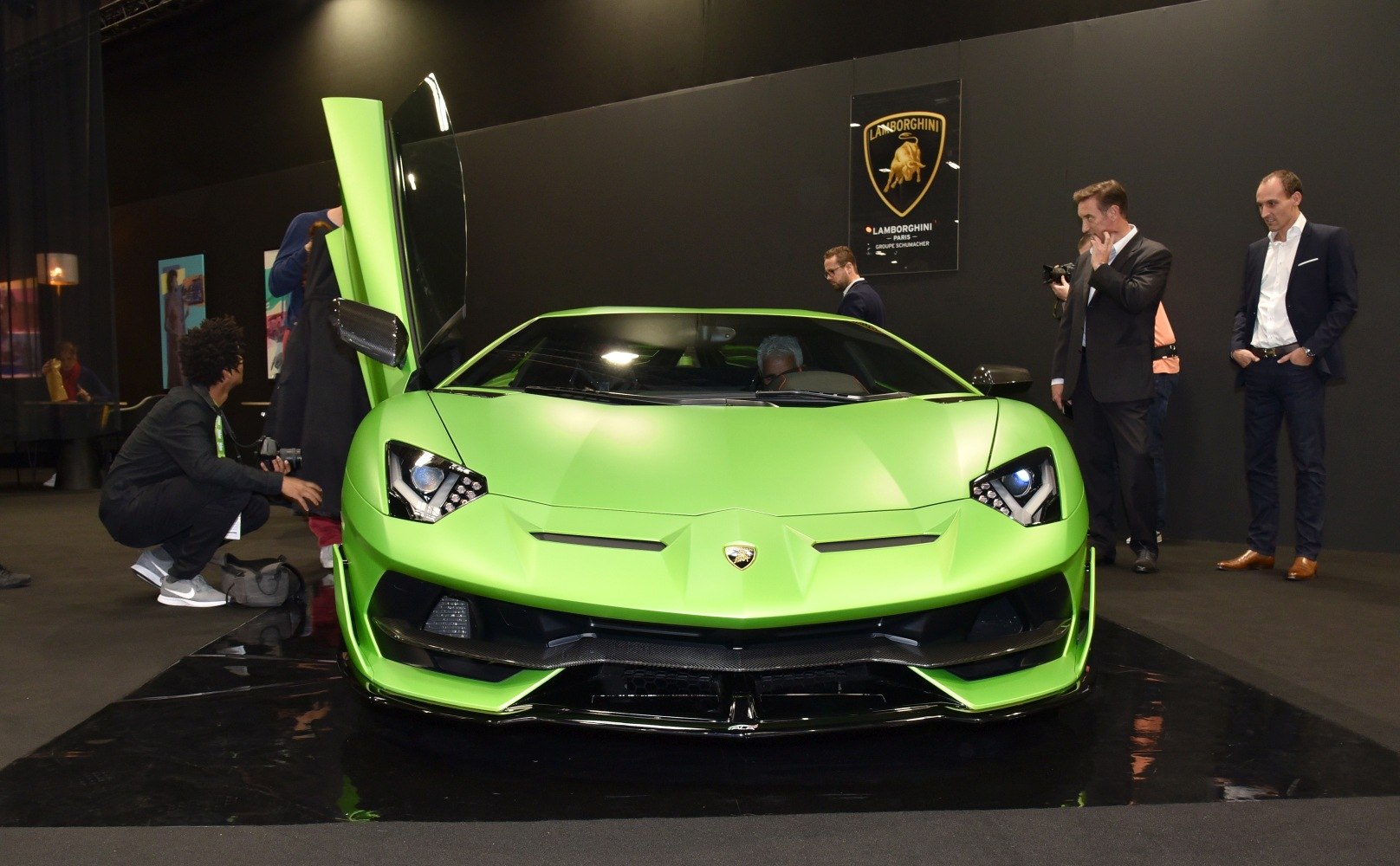 Front view with scissor doors and aggressive headlights