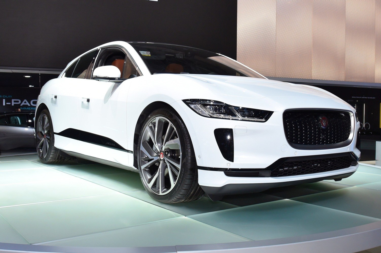 Electric SUV with sharp LED headlights and aerodynamic front design