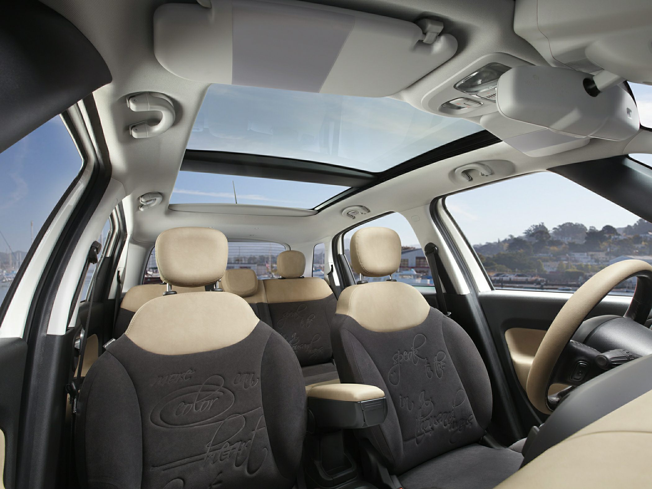 Panoramic sunroof and beige-black dual-tone upholstery seats