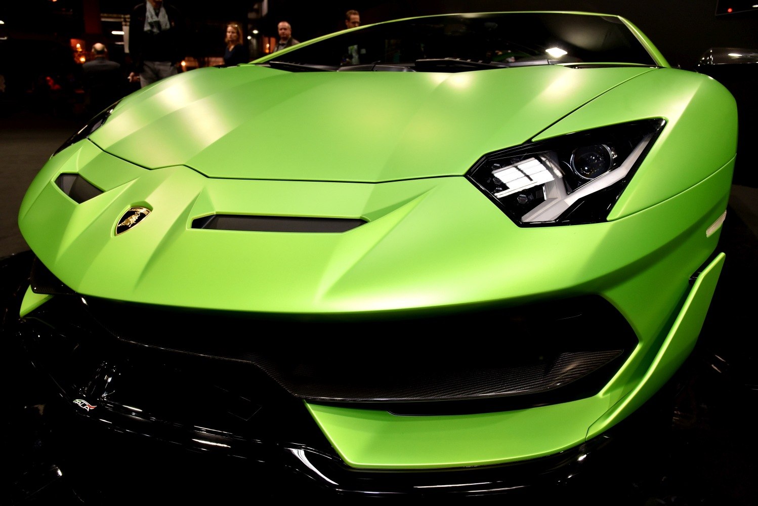 Sharp headlights and aggressive hood design in close-up view