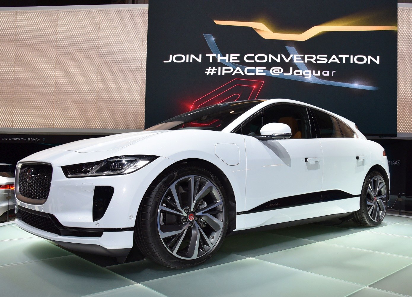 Sleek front and side view of an electric SUV with modern wheels and LED headlights