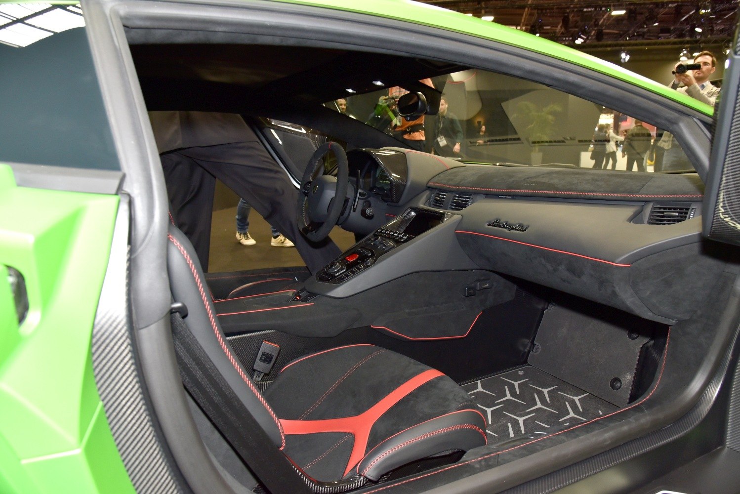 Black Alcantara interior with red stitching and carbon fiber accents