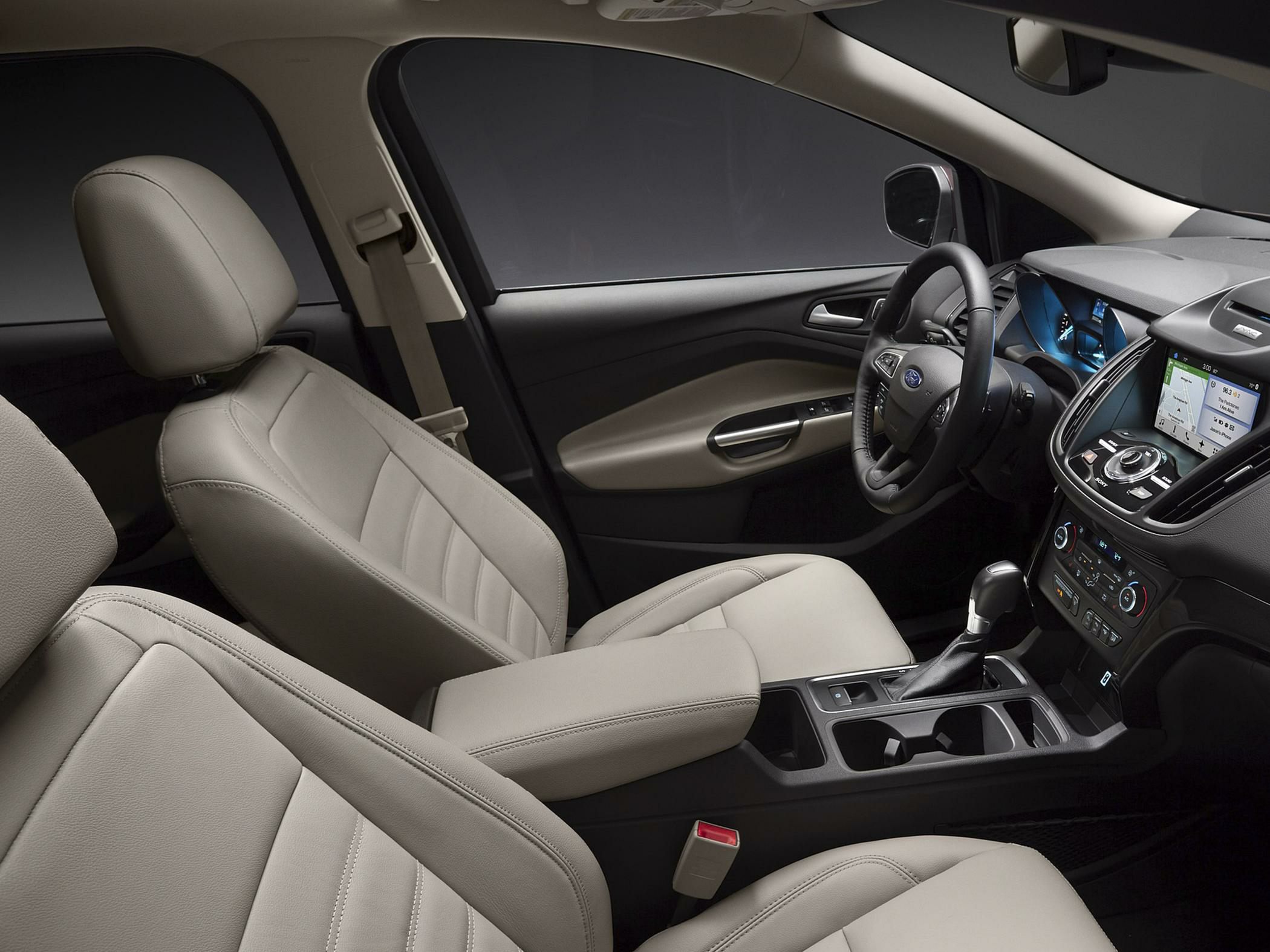 Beige leather seats, touchscreen infotainment, ergonomic center console