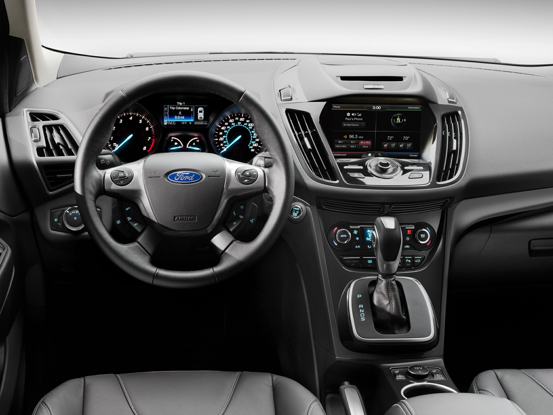 Dashboard, steering wheel, infotainment, climate controls, automatic gear shifter