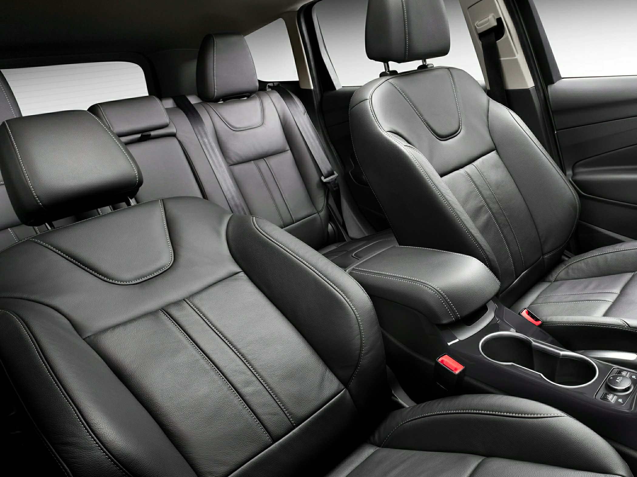 Black leather front and rear seats with detailed stitching