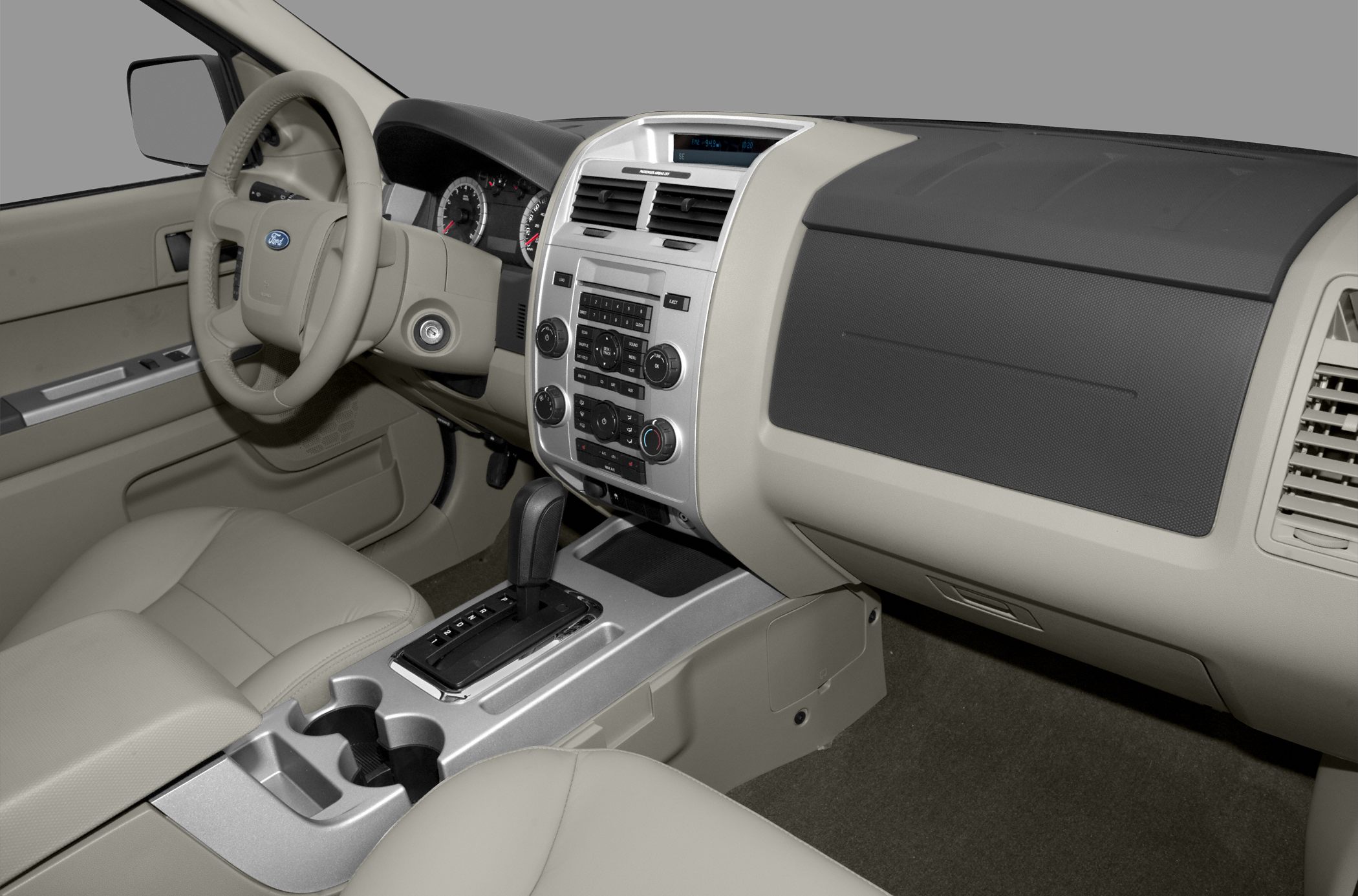 Car interior showing dashboard, steering wheel, and center console
