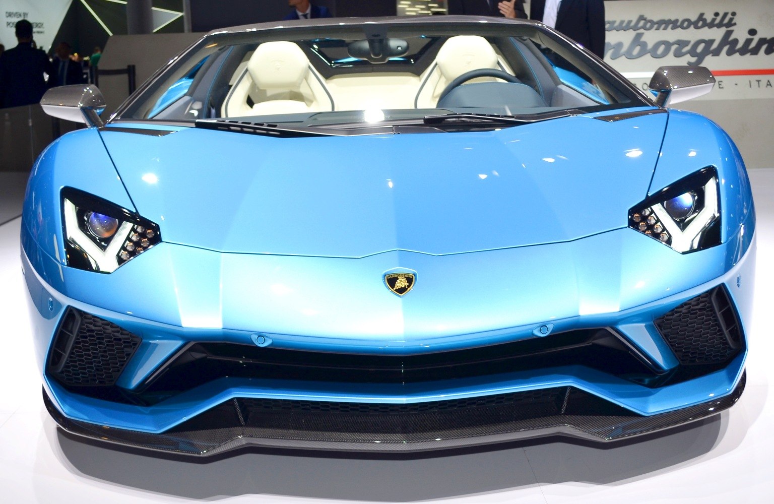 Distinctive angular headlights and visible luxury open cockpit interior