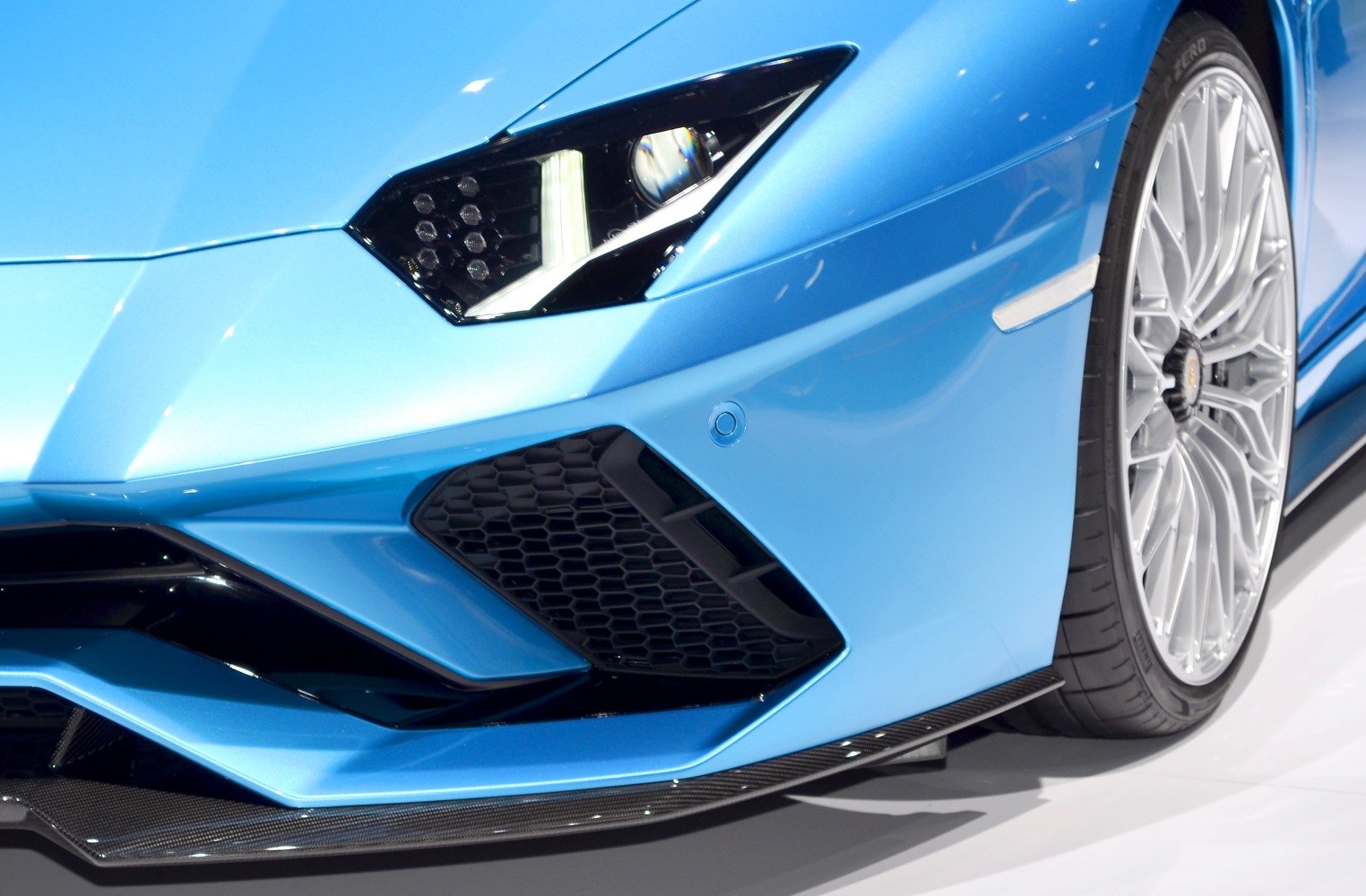 Close-up of aggressive front headlight and alloy wheel