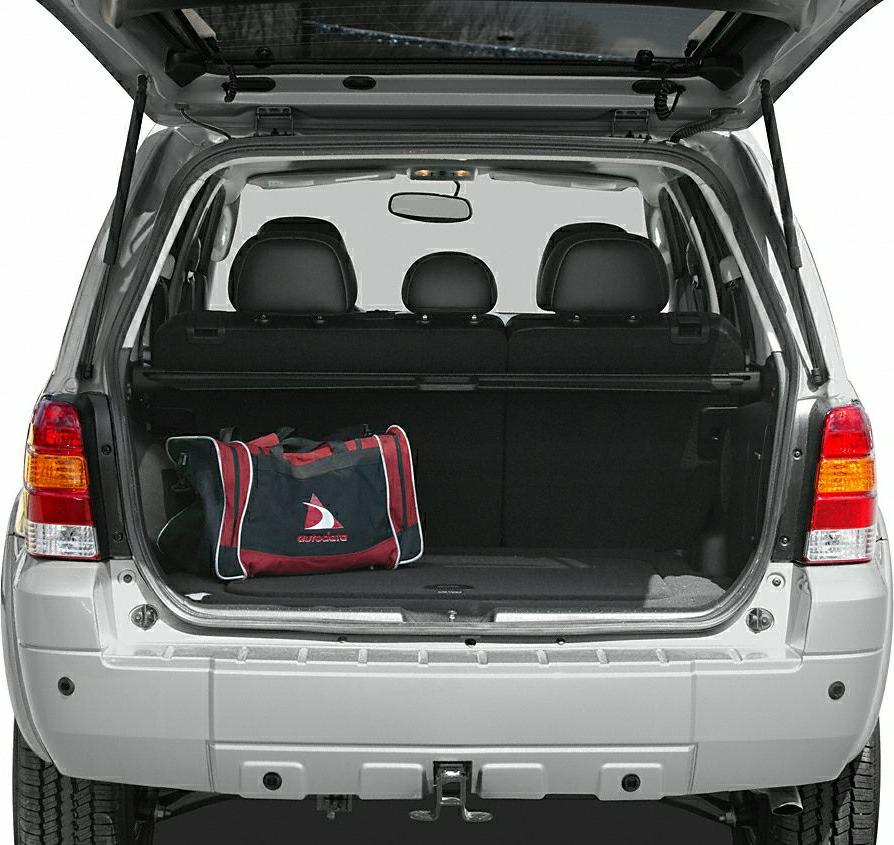 Open rear cargo space with foldable seats and a sports bag