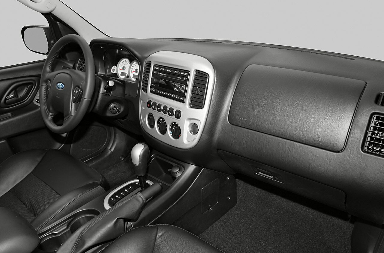 Dashboard and center console with gauges, steering wheel, and gear shifter