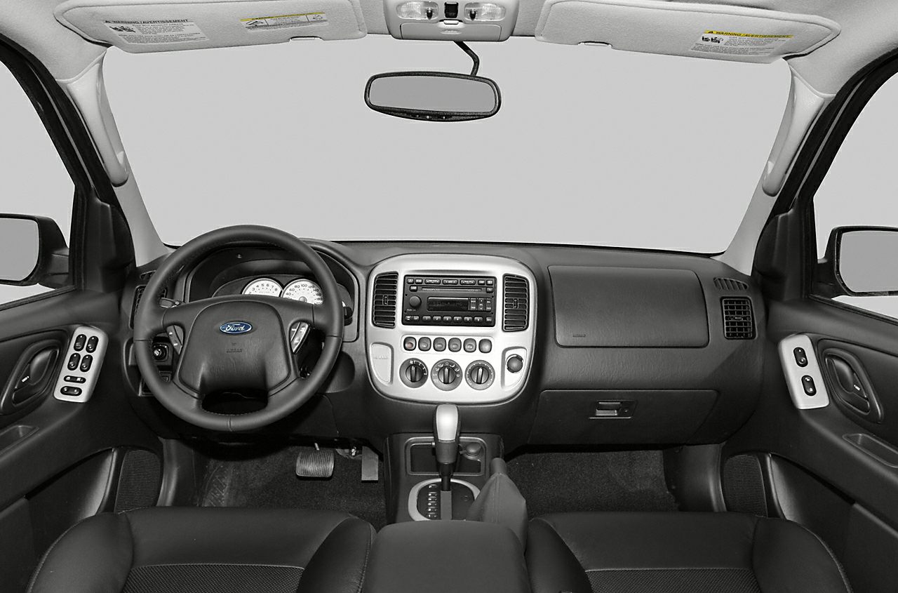 Dashboard and steering wheel with center console controls.