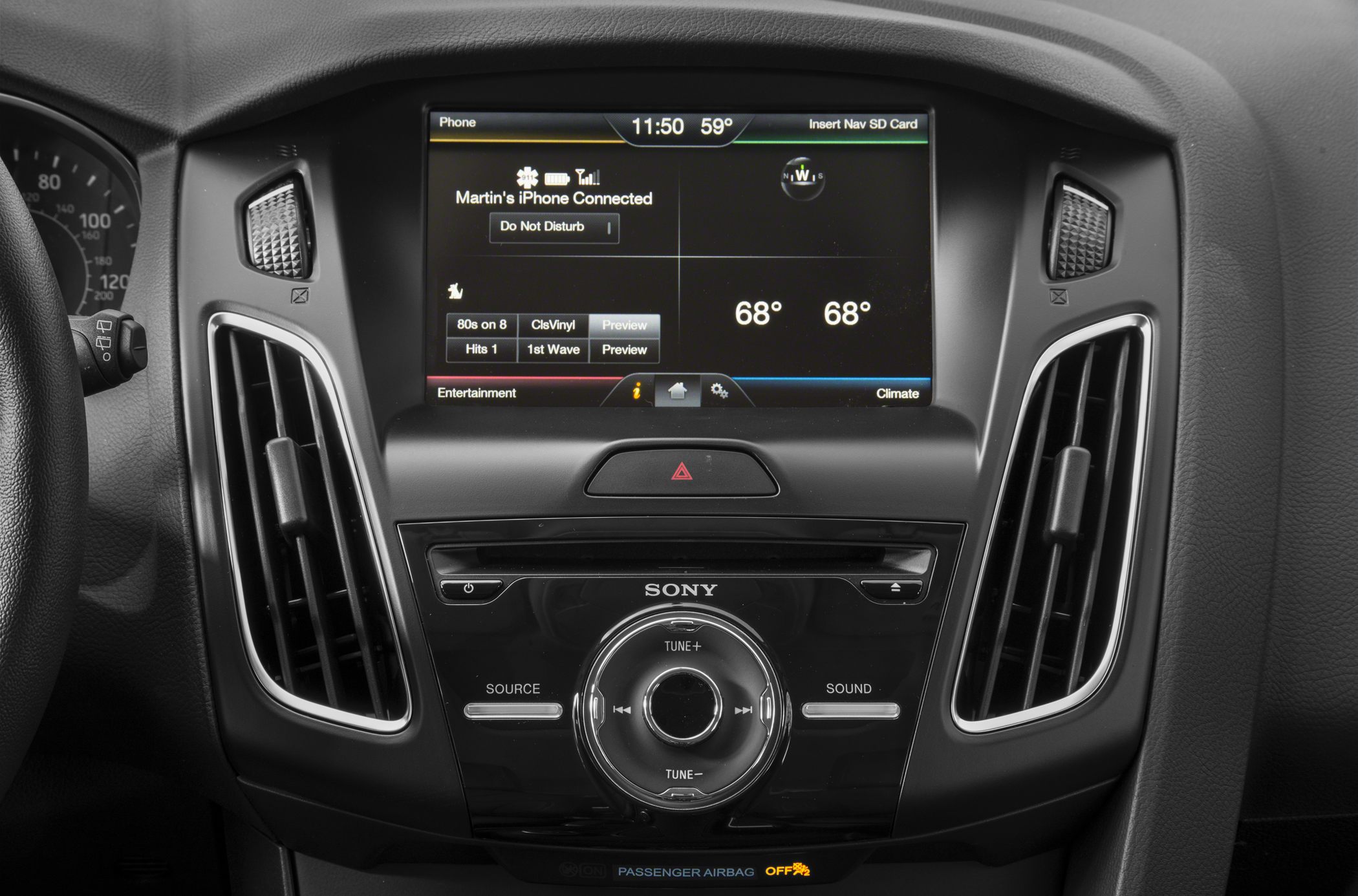 Close-up of infotainment system and dashboard controls in a car interior