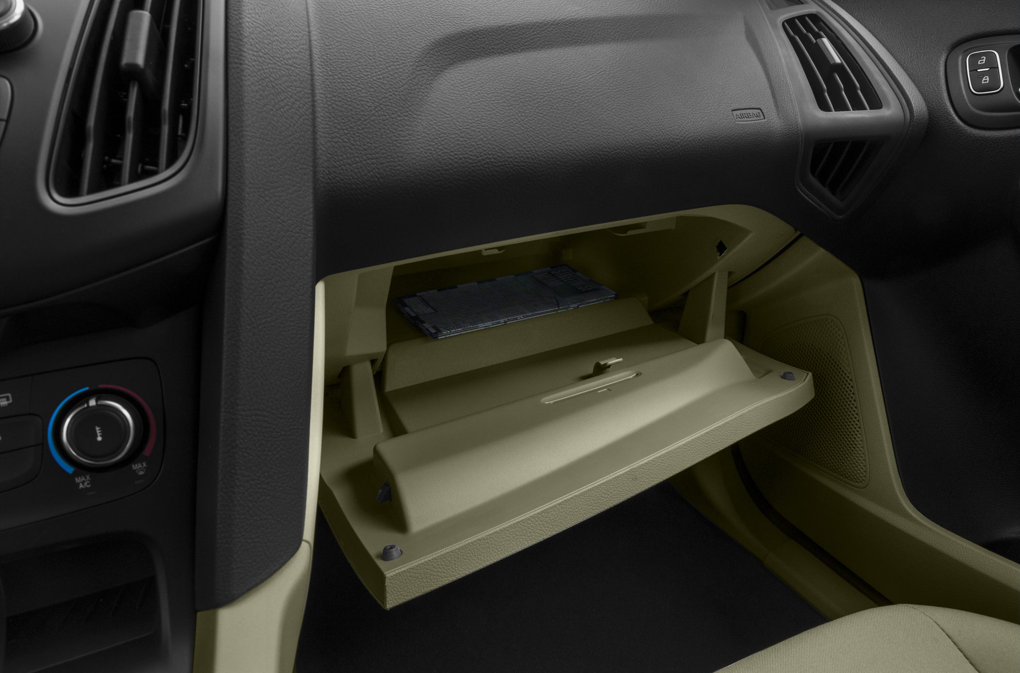 Open glove compartment with storage space inside car dashboard