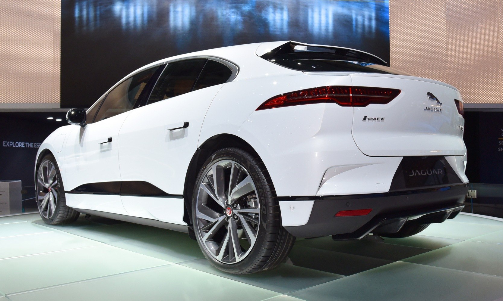 Rear and side view of sleek electric SUV with distinctive tail lights