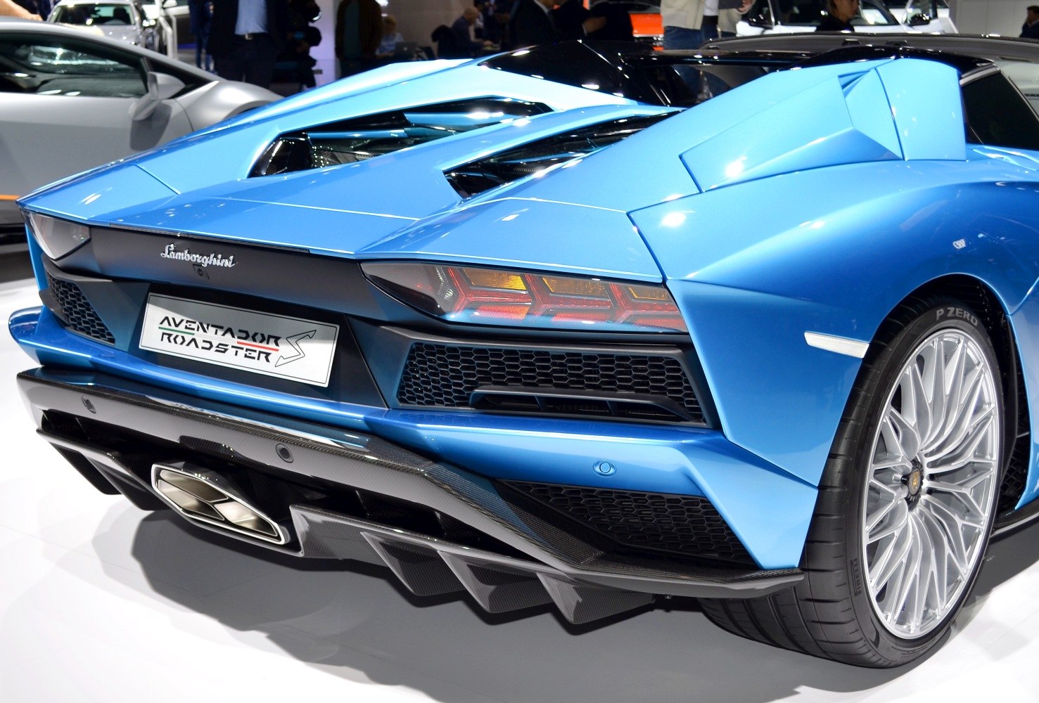 Rear tail lights, exhaust system, and diffuser with aerodynamic detailing