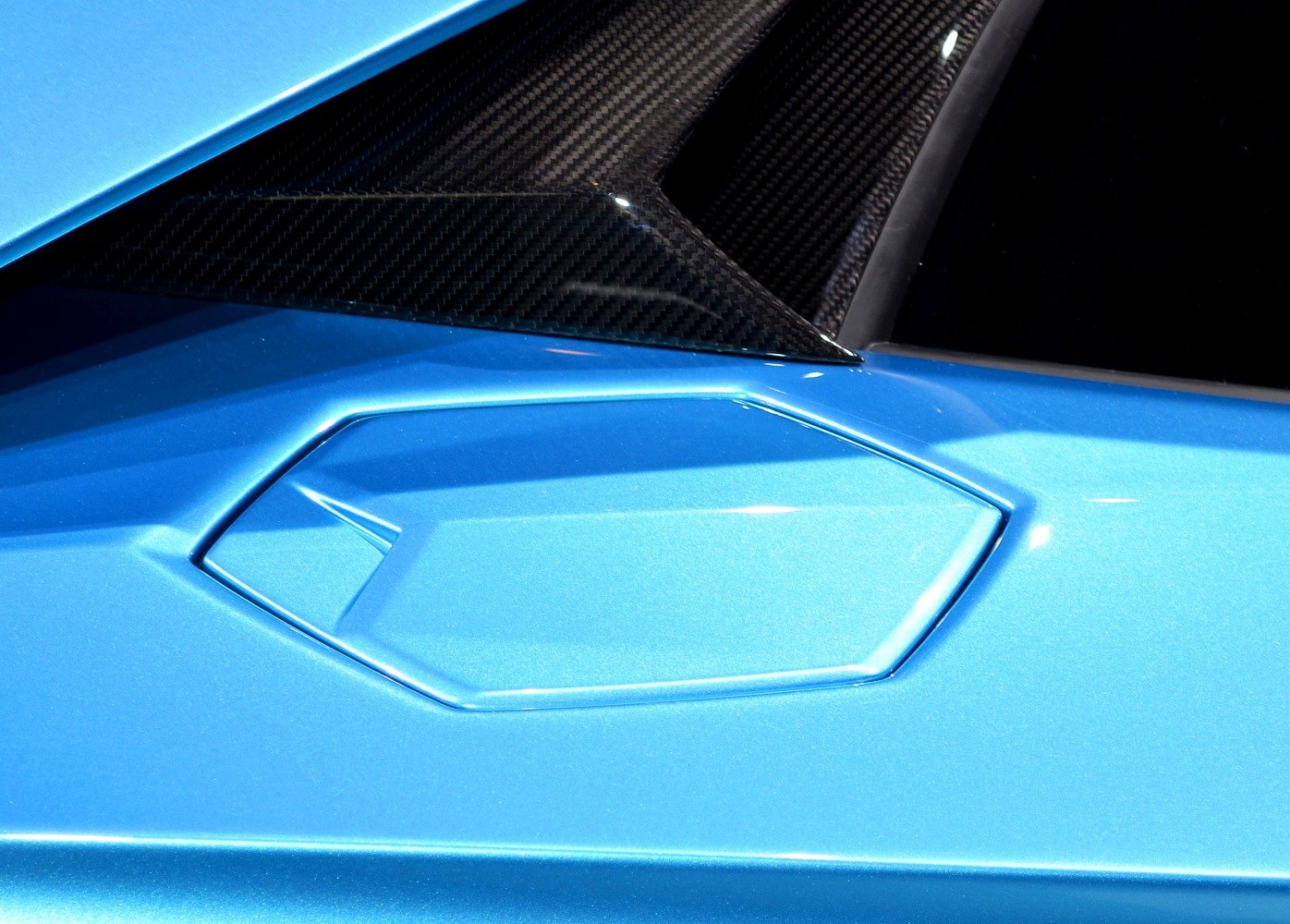 Hexagonal fuel cap and carbon fiber panel detail