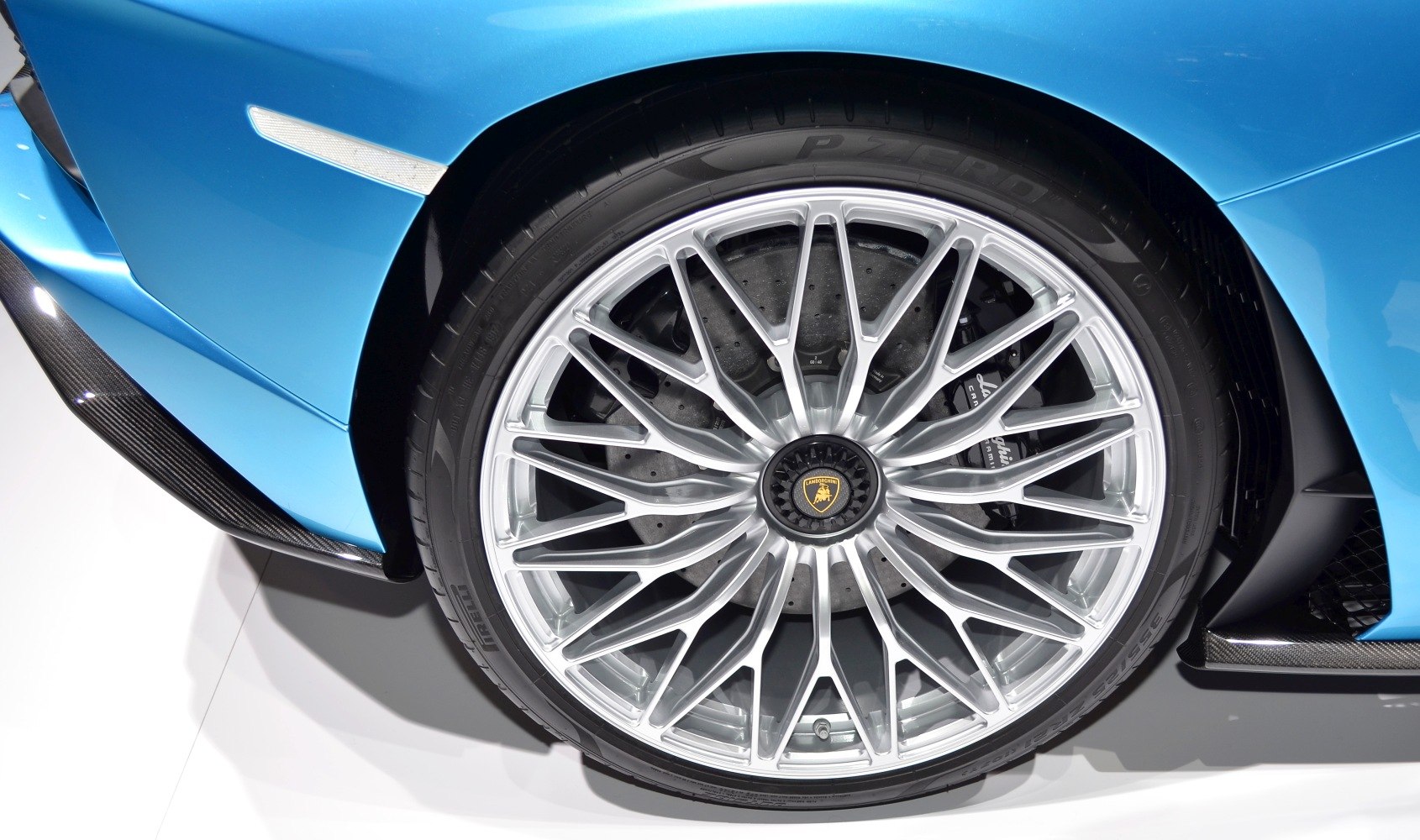 Close-up of sporty alloy wheel with detailed spokes and brake disc