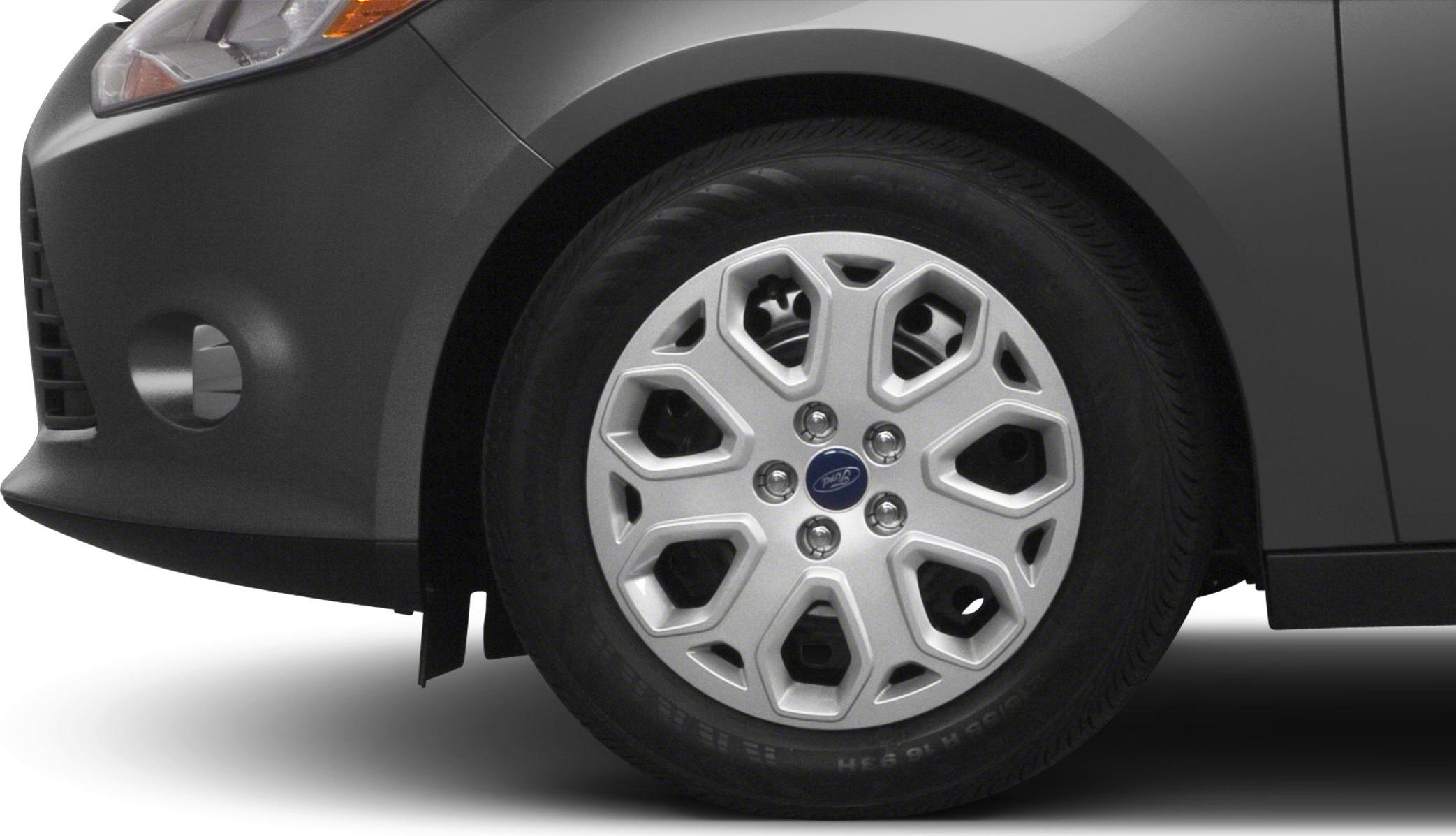 Distinctive alloy wheel and front fender section with tire sidewall visible