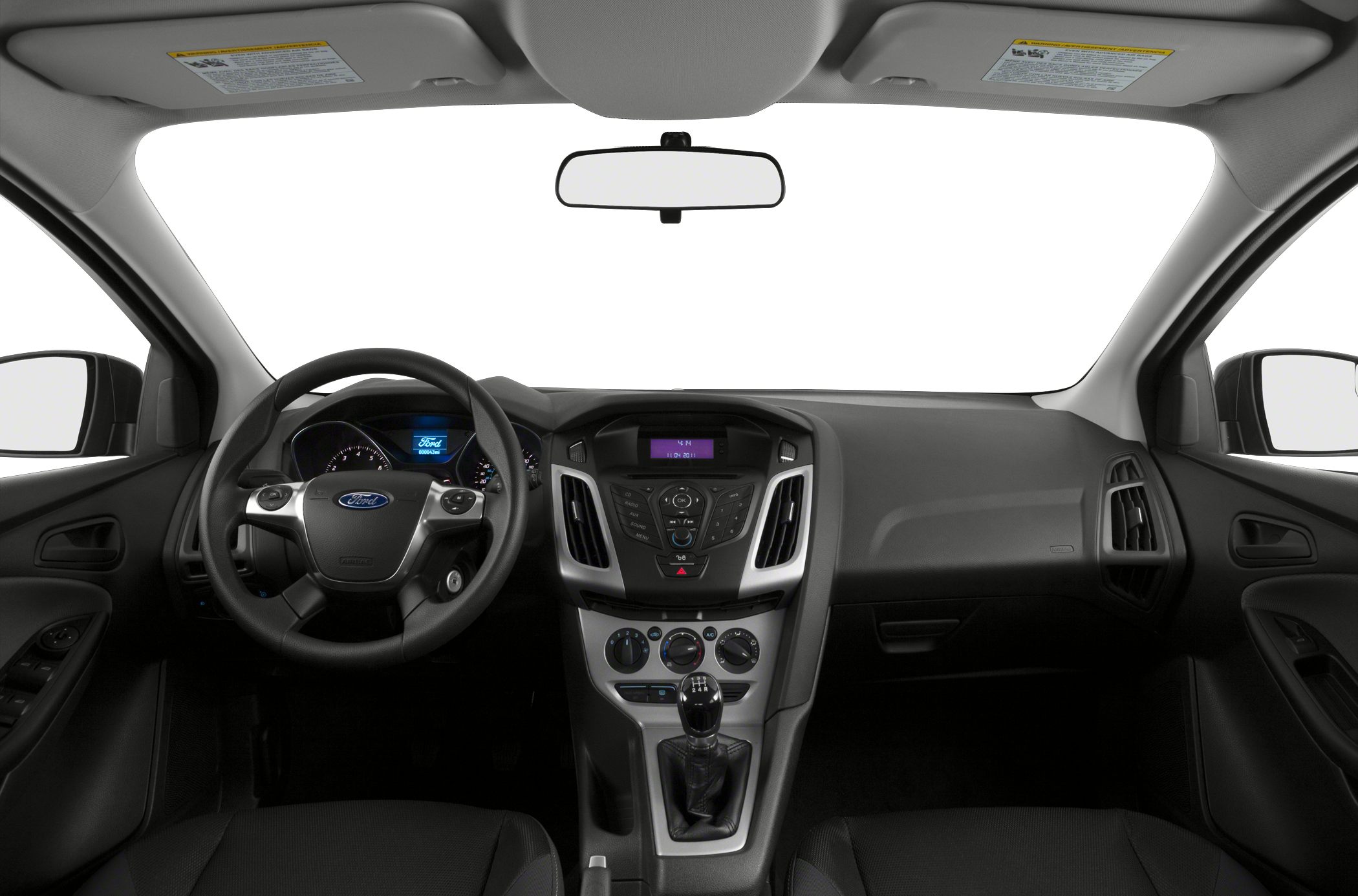 Dashboard, steering wheel, and manual gear stick in hatchback interior