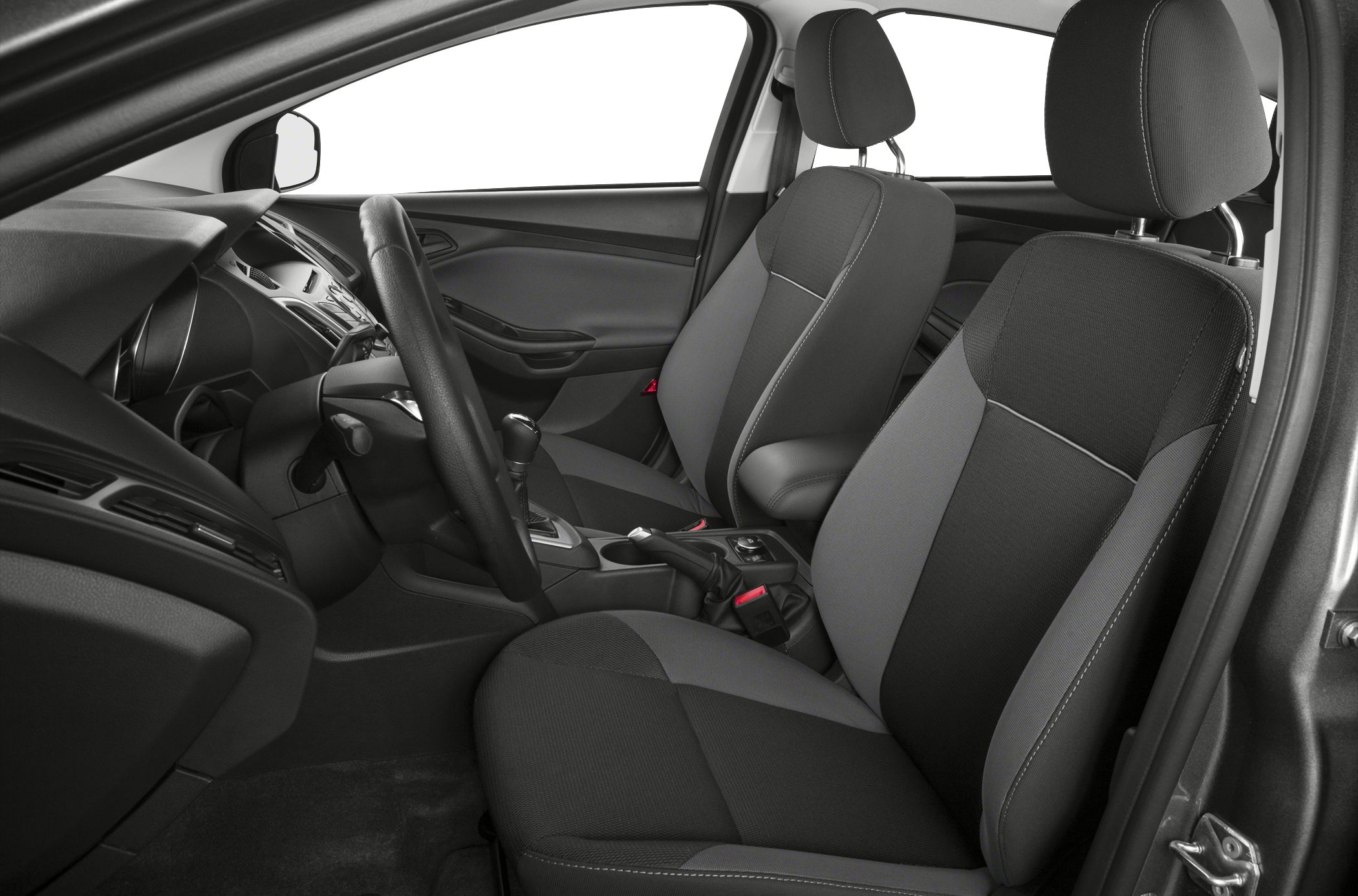 Front seats and dashboard interior with steering wheel and gear shift