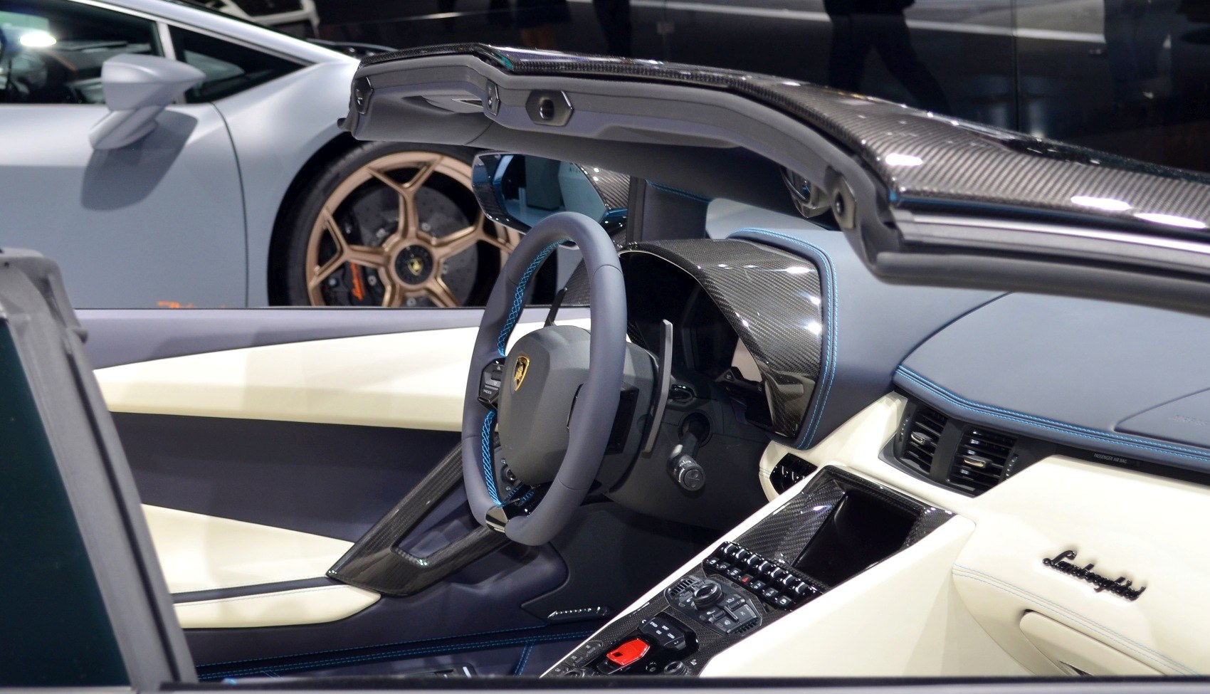 Carbon fiber interior with blue stitching and advanced steering wheel design