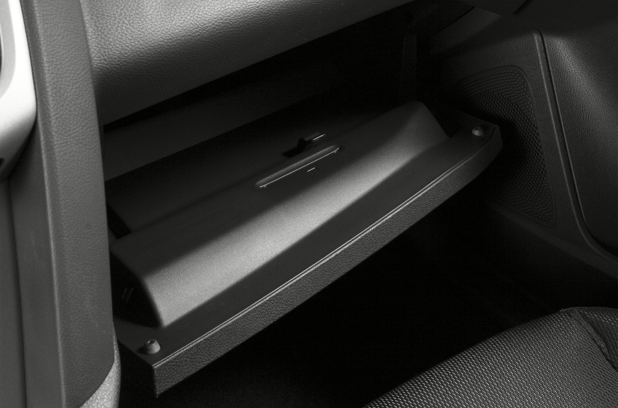 Open glove compartment inside car interior