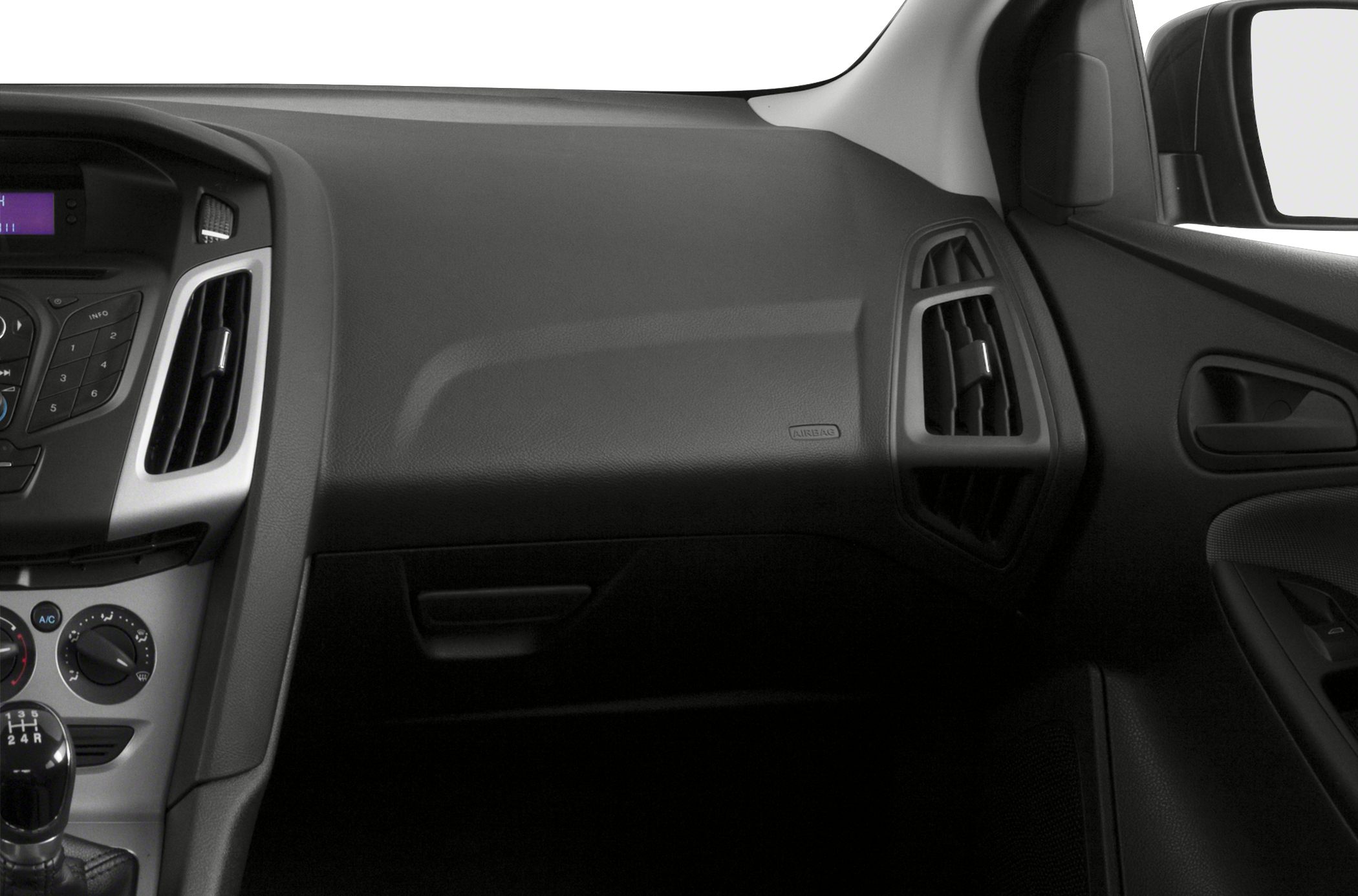 Interior dashboard with air vents and manual gear shift