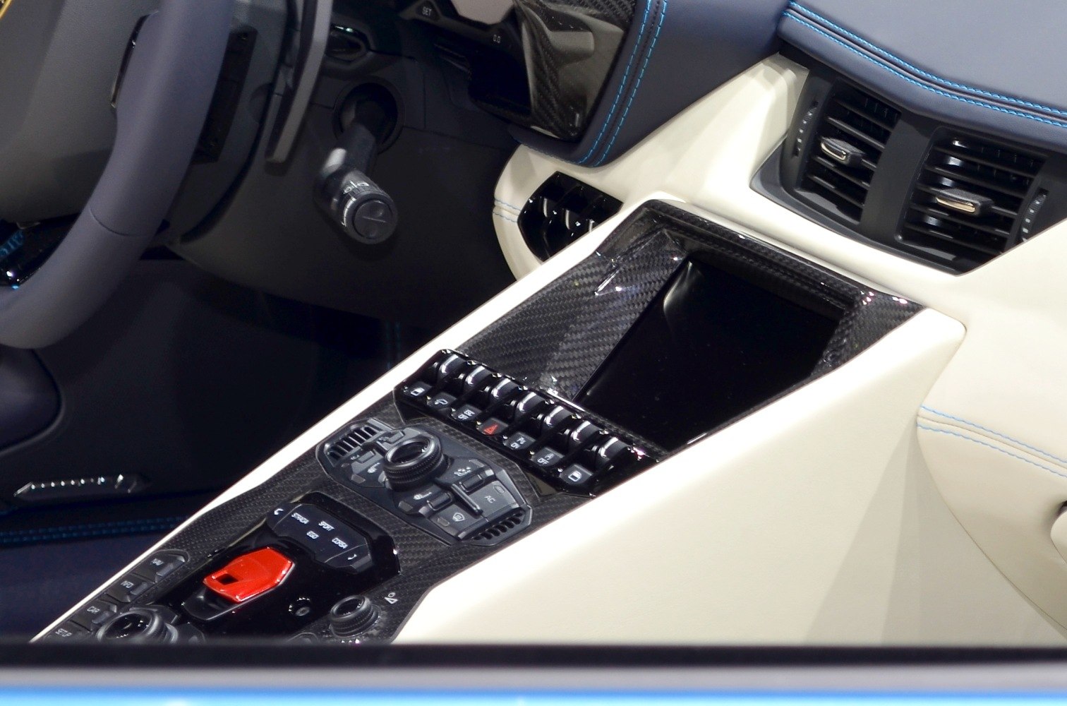 Interior center console with carbon fiber trim and control buttons