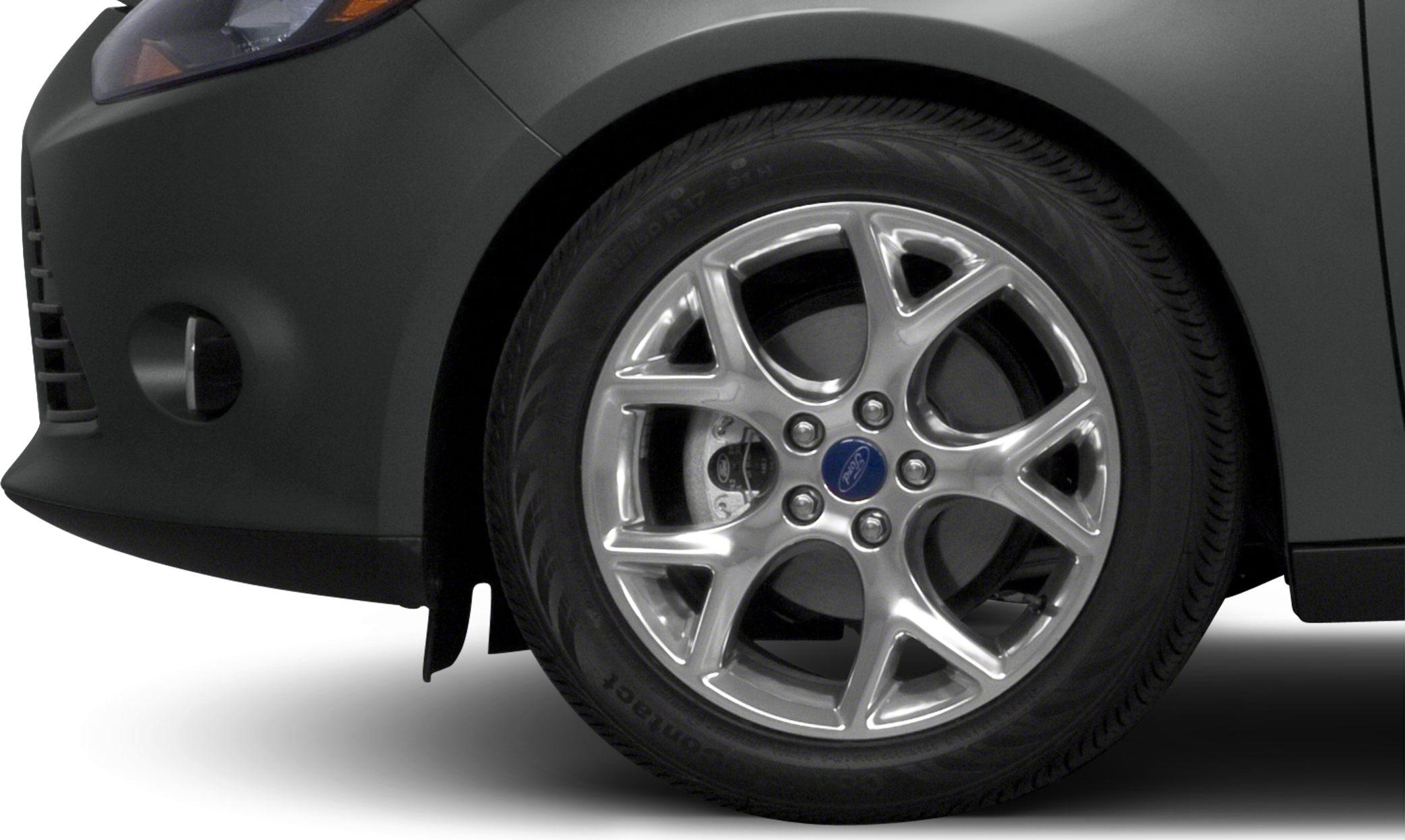 Alloy wheel and front bumper close-up with detailed rim and tire tread