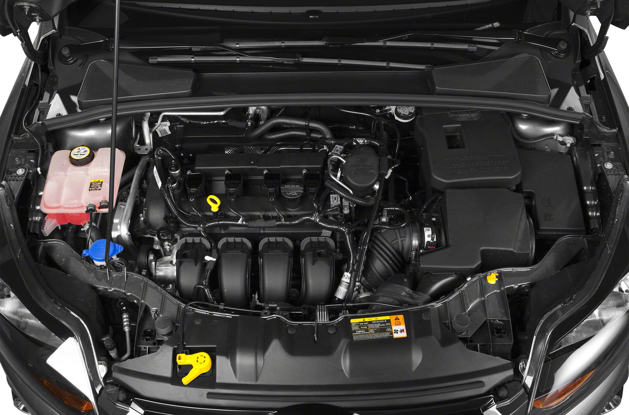 Close-up of a modern car engine bay with visible components and layout.