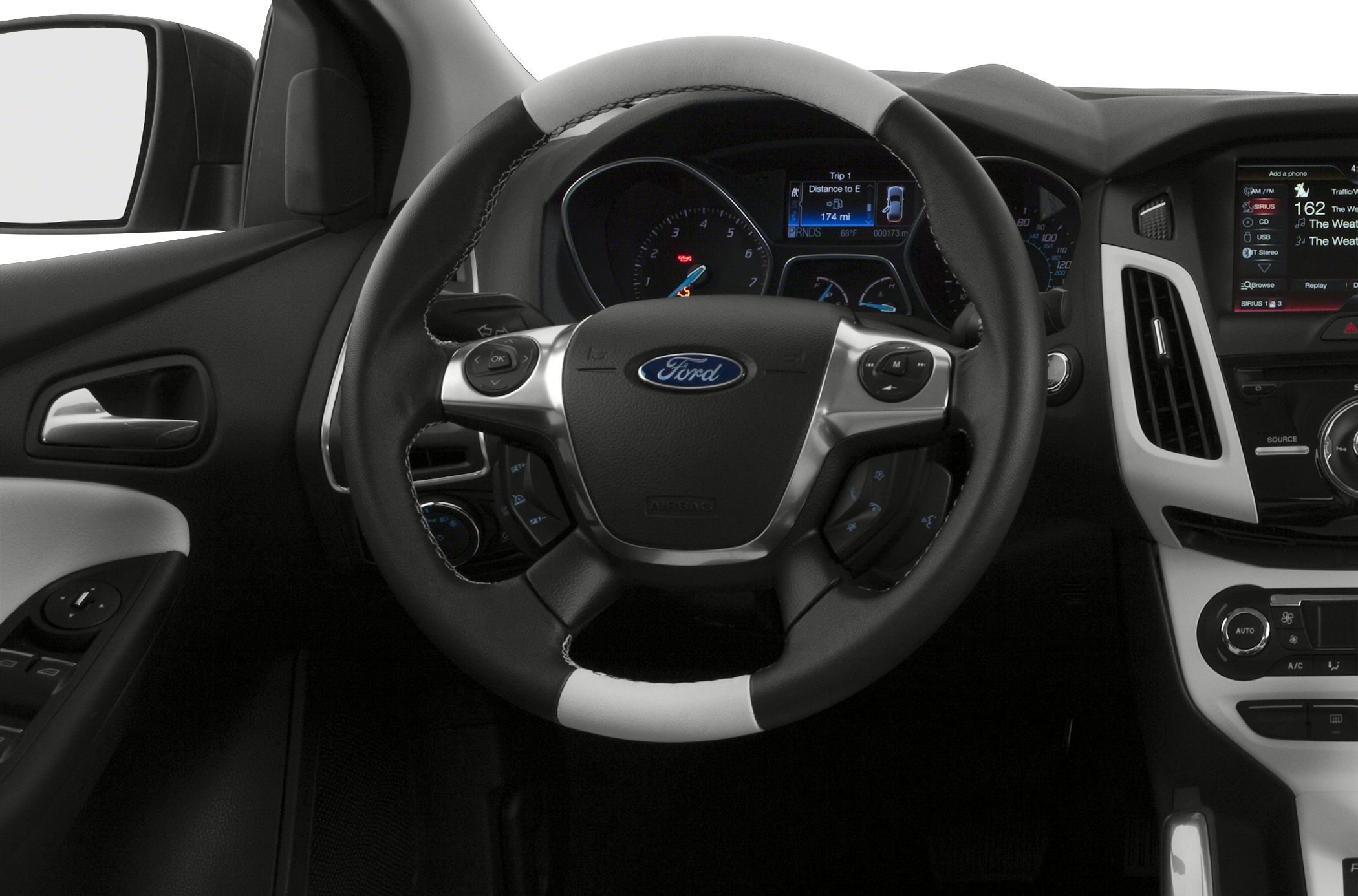 Steering wheel and dashboard controls in car interior